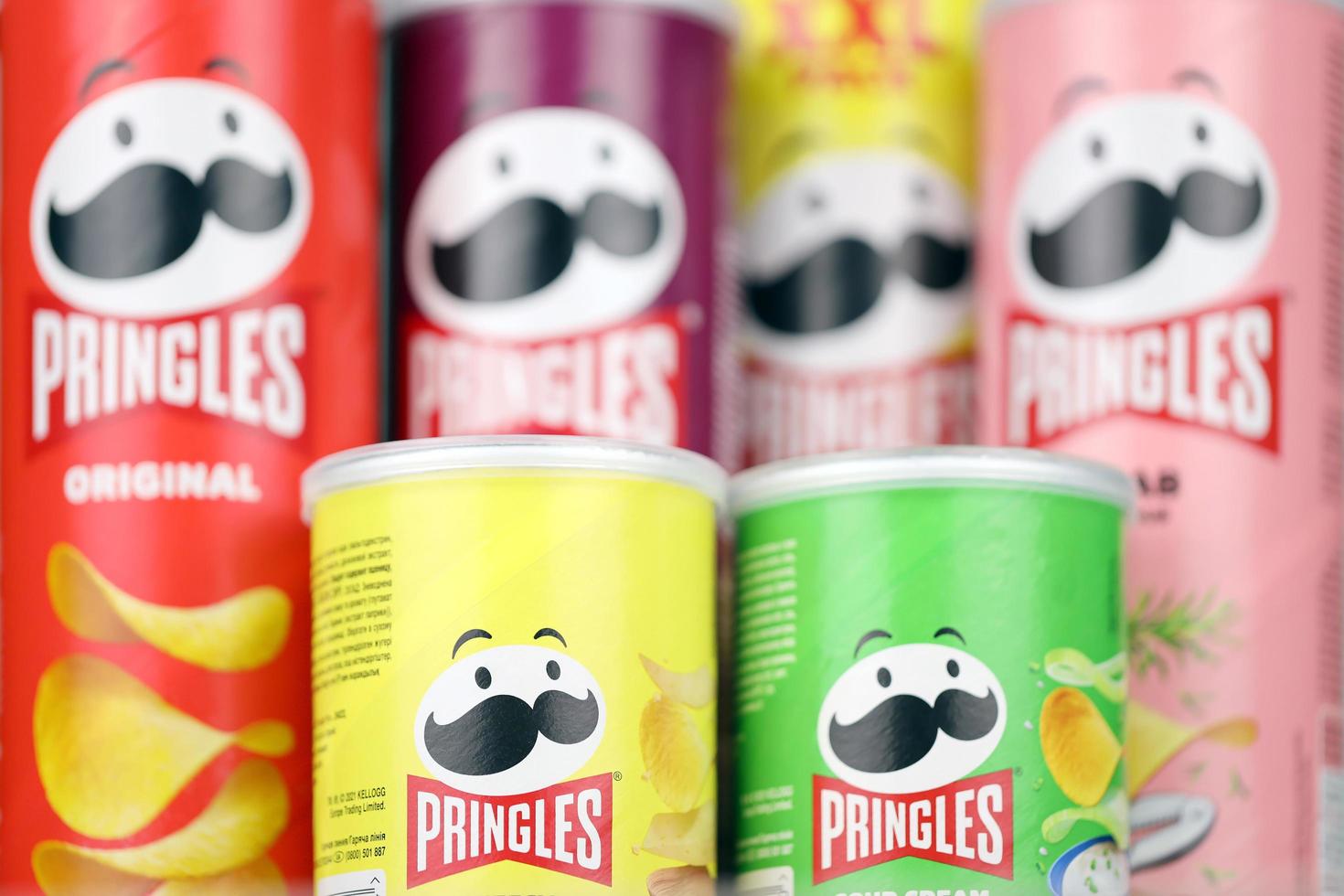 KHARKIV, UKRAINE - DECEMBER 16, 2021 Pringles product with new logo. Pringles is a brand of potato snack chips owned by the Kellogg Company photo