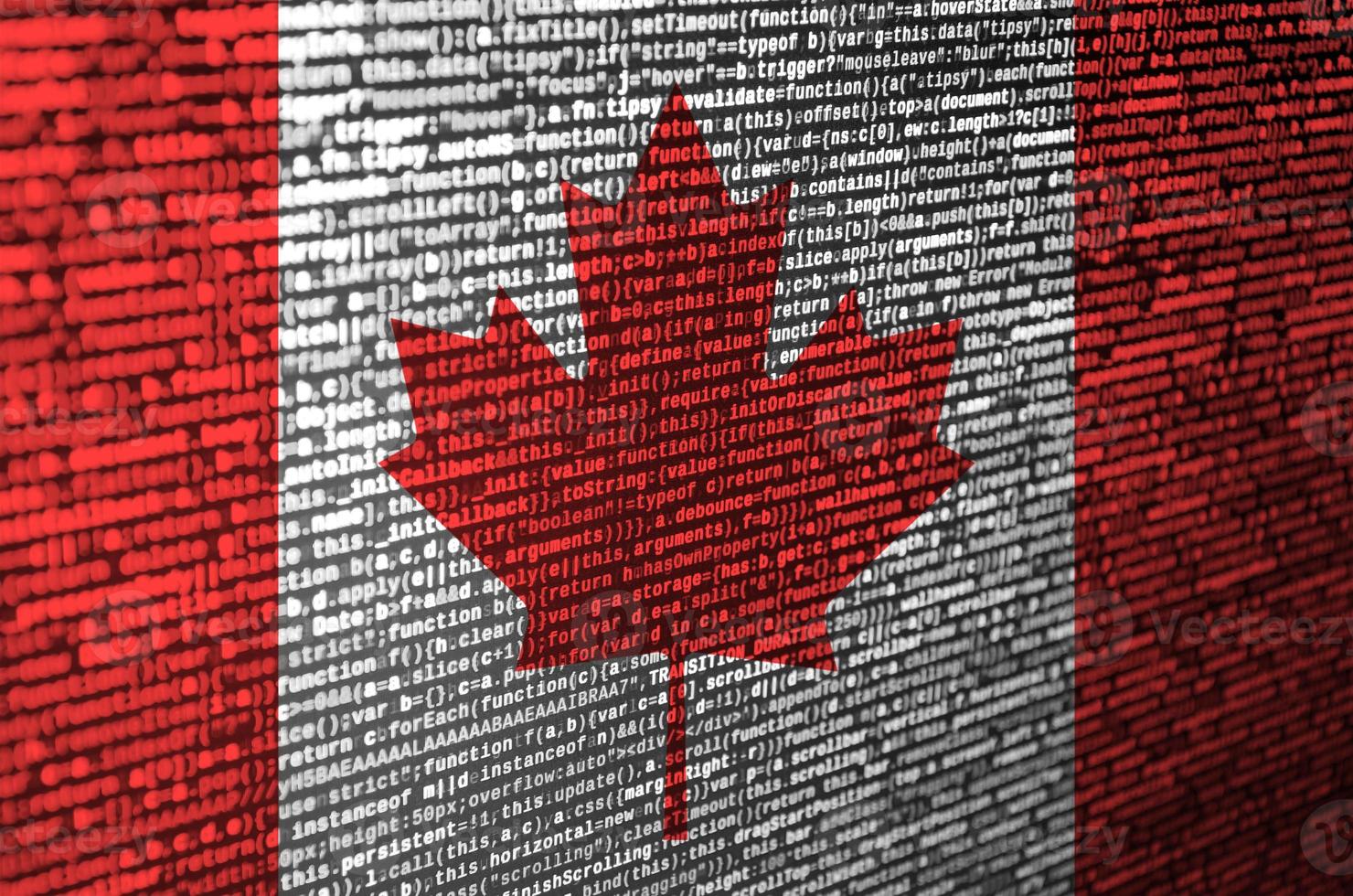 Canada flag  is depicted on the screen with the program code. The concept of modern technology and site development photo