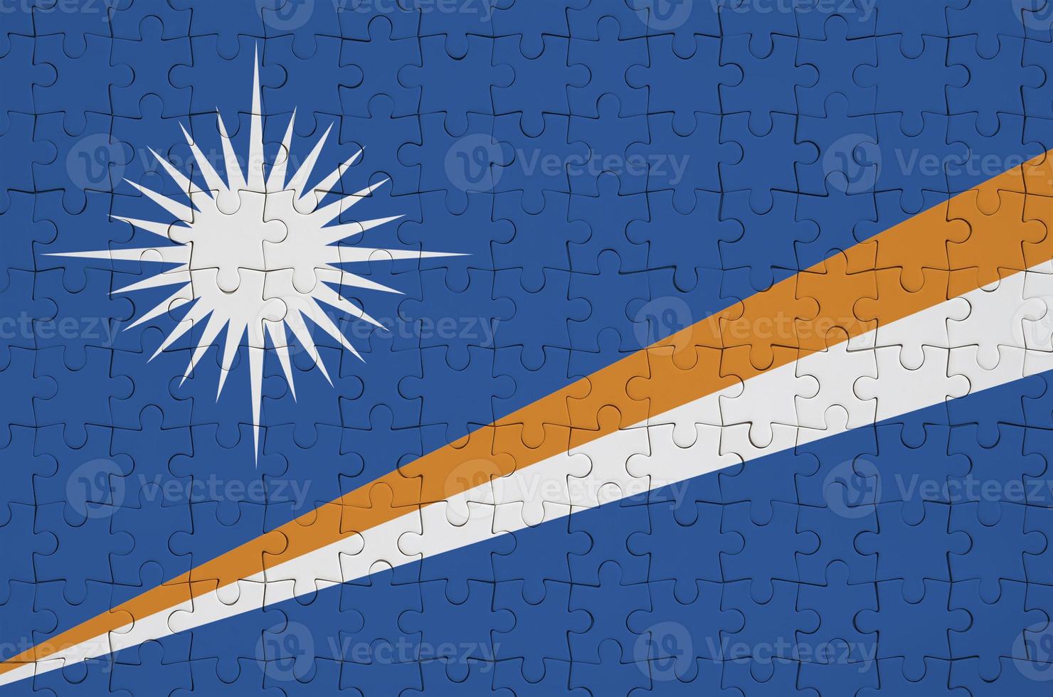 Marshall Islands flag  is depicted on a folded puzzle photo