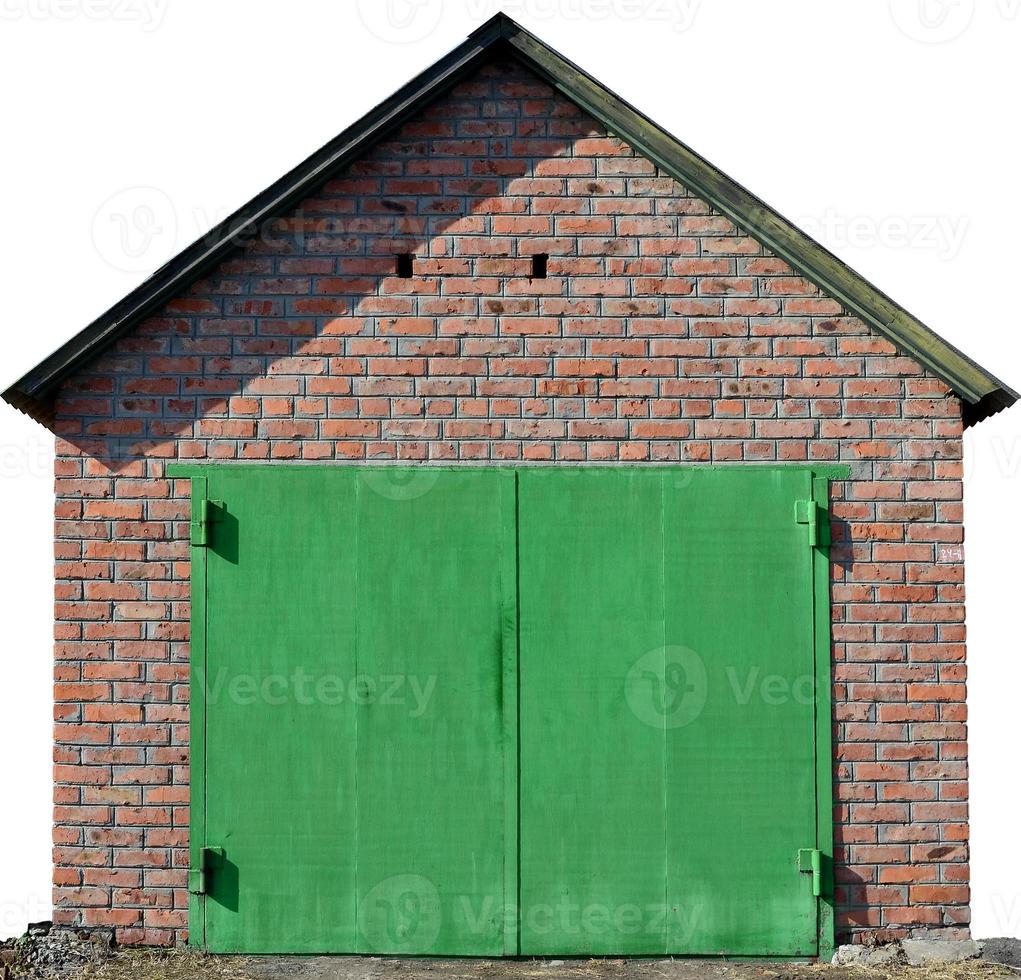 The texture of a painted metal gate from a brick garage photo