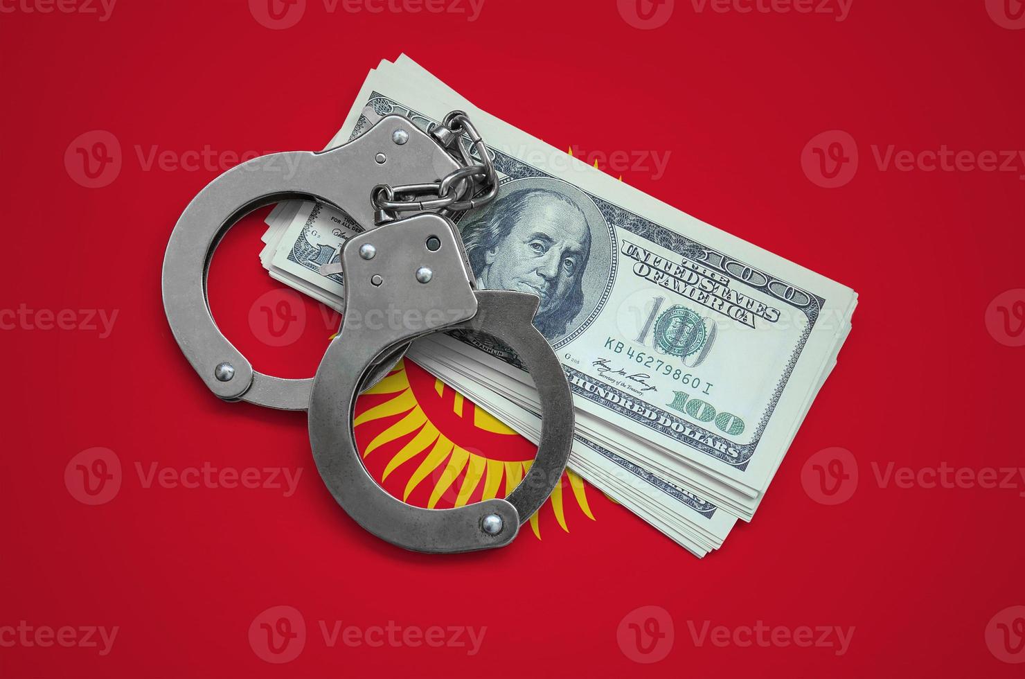 Kyrgyzstan flag  with handcuffs and a bundle of dollars. Currency corruption in the country. Financial crimes photo