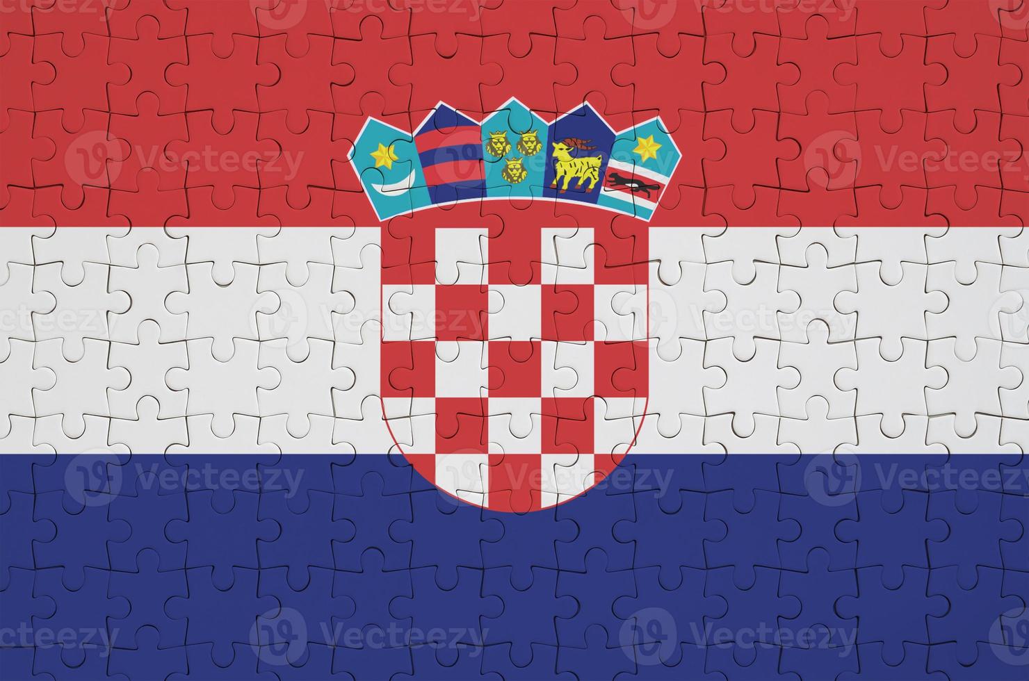 Croatia flag  is depicted on a folded puzzle photo