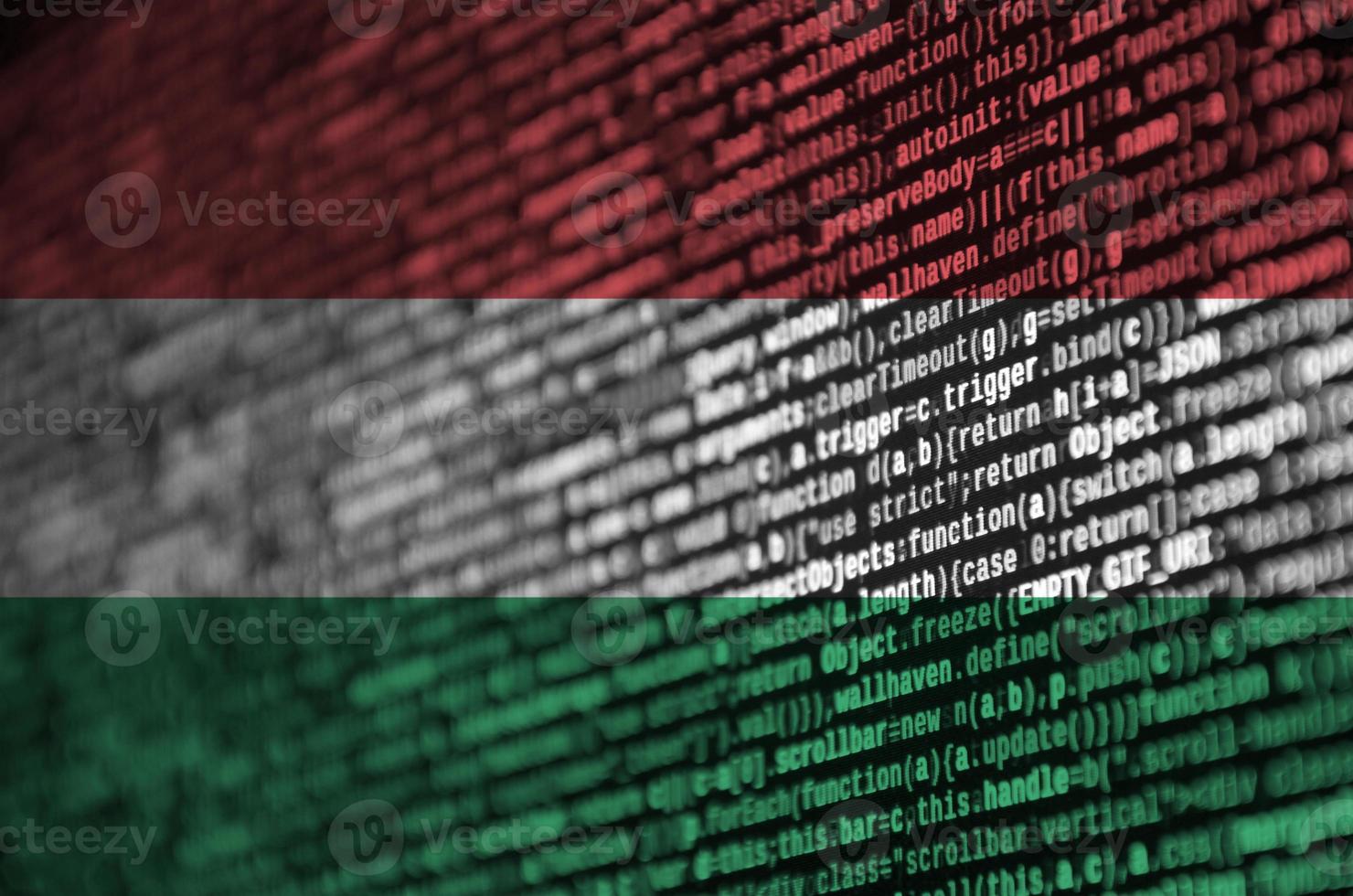 Hungary flag  is depicted on the screen with the program code. The concept of modern technology and site development photo