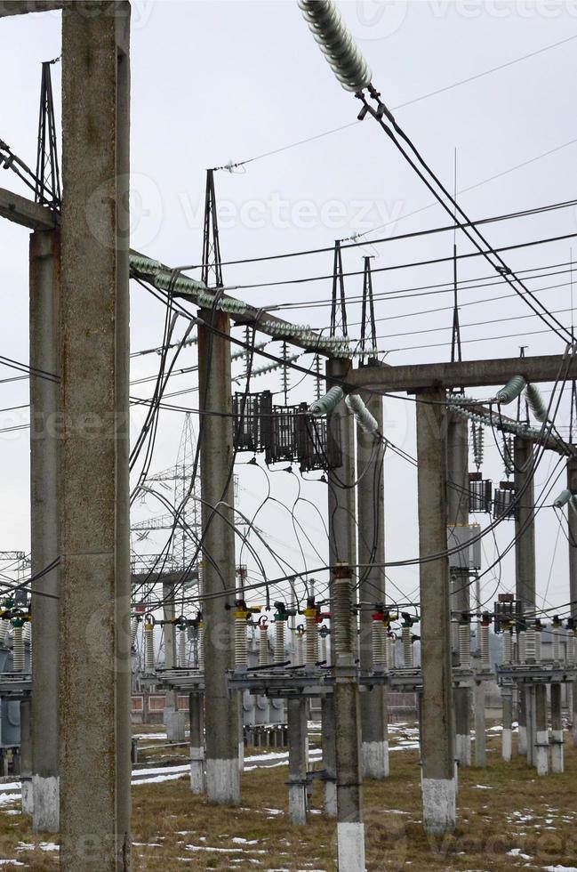 Power plant is a station of transformation. A lot of cables, poles and wires, transformers. Electro-energy. photo