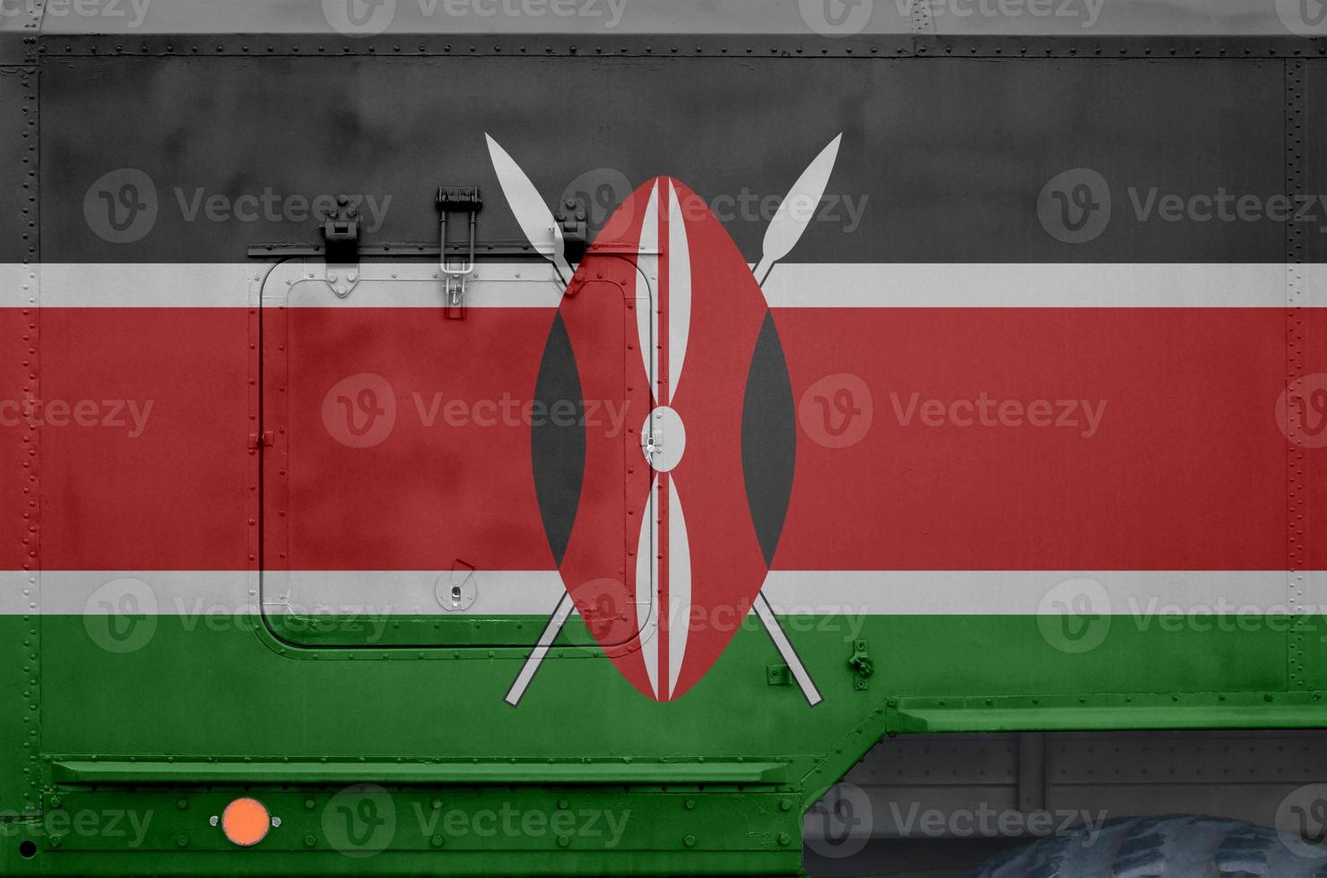 Kenya flag depicted on side part of military armored truck closeup. Army forces conceptual background photo