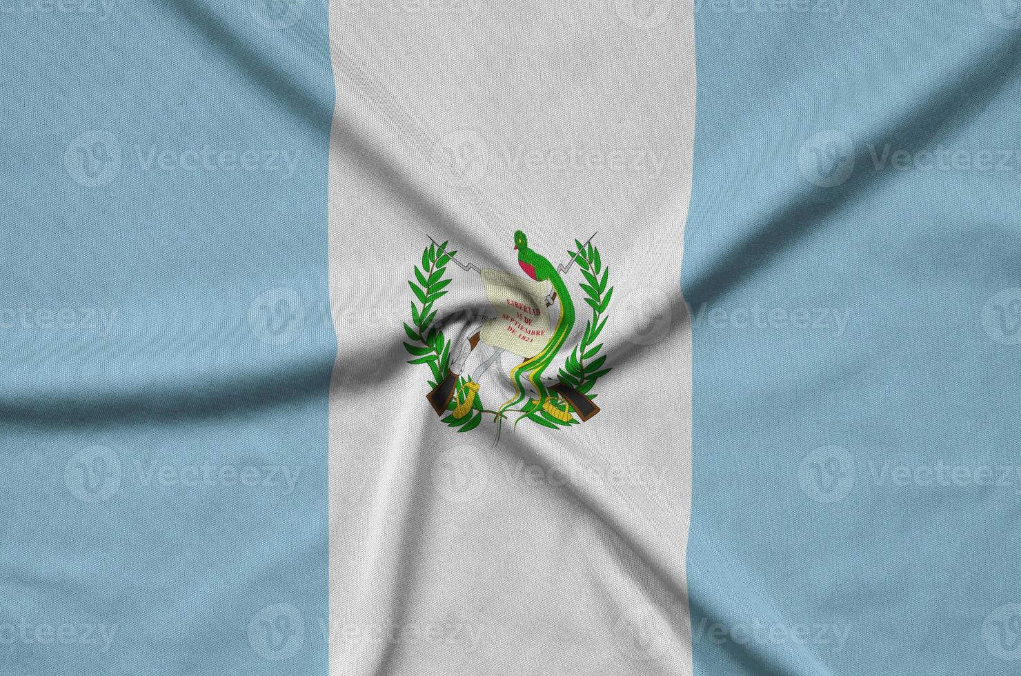 Guatemala flag  is depicted on a sports cloth fabric with many folds. Sport team banner photo