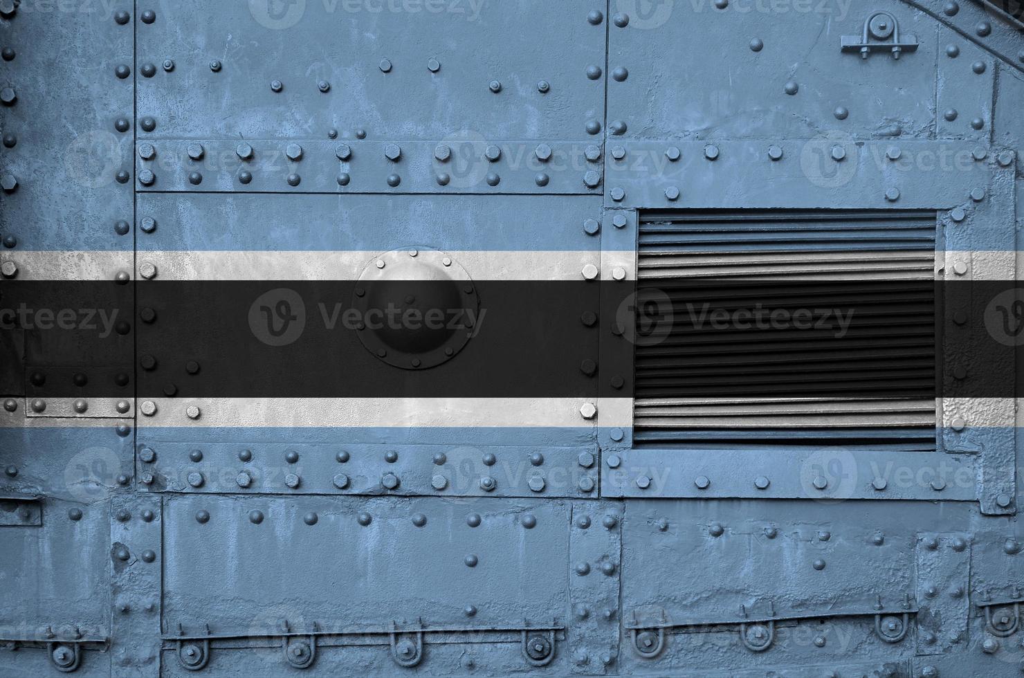 Botswana flag depicted on side part of military armored tank closeup. Army forces conceptual background photo