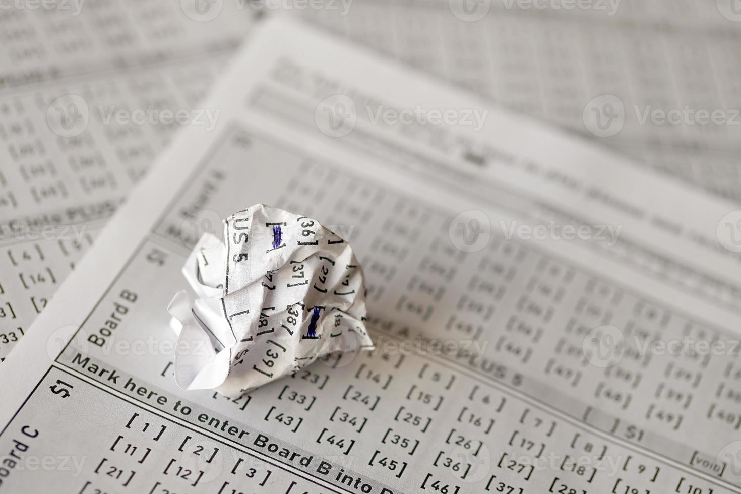 Crumpled lottery tickets as symbol of losing the lottery game. Unlucky gambling results. Misfortune photo