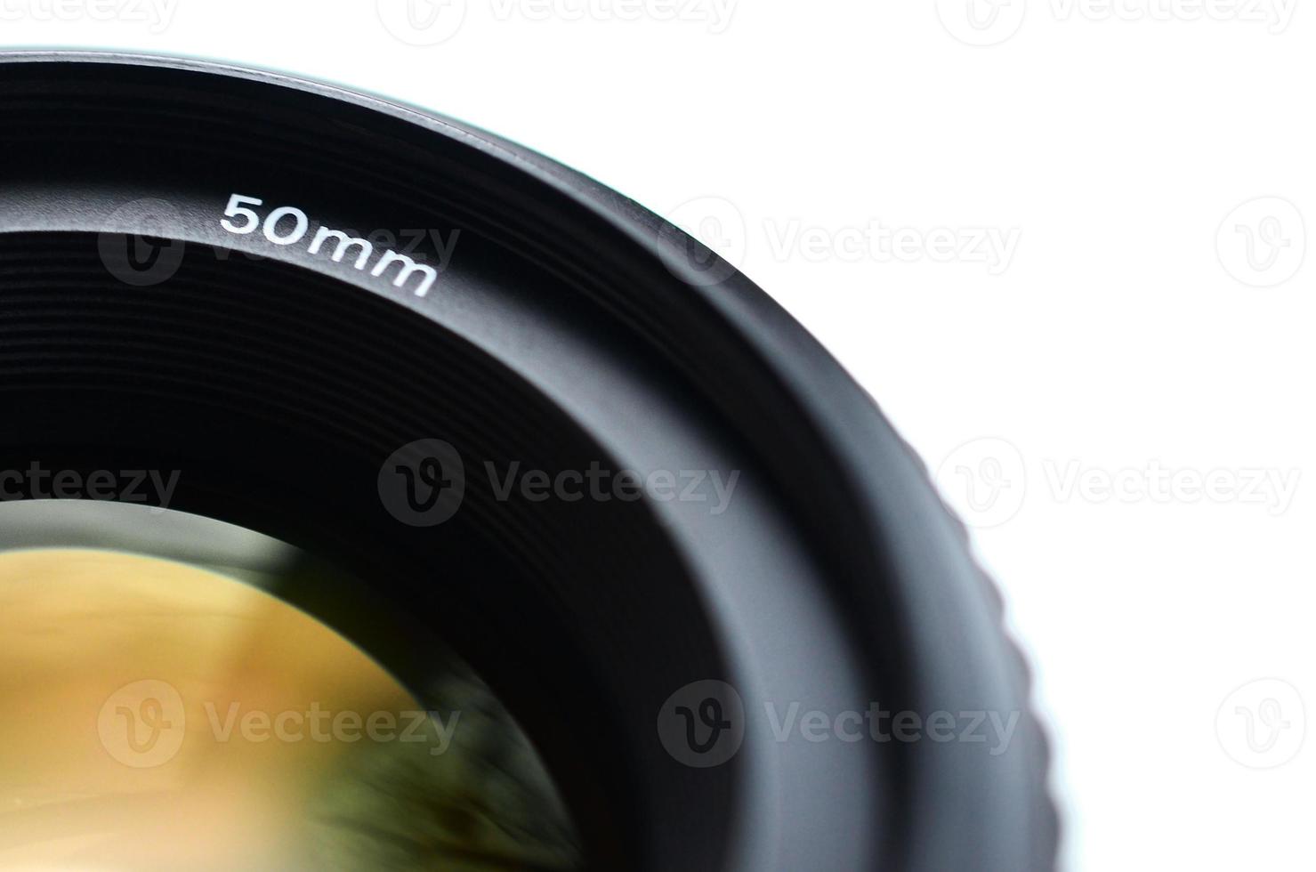 Fragment of a portrait lens for a modern SLR camera. A photograph of a wide-aperture lens with a focal length of 50mm isolated on white photo