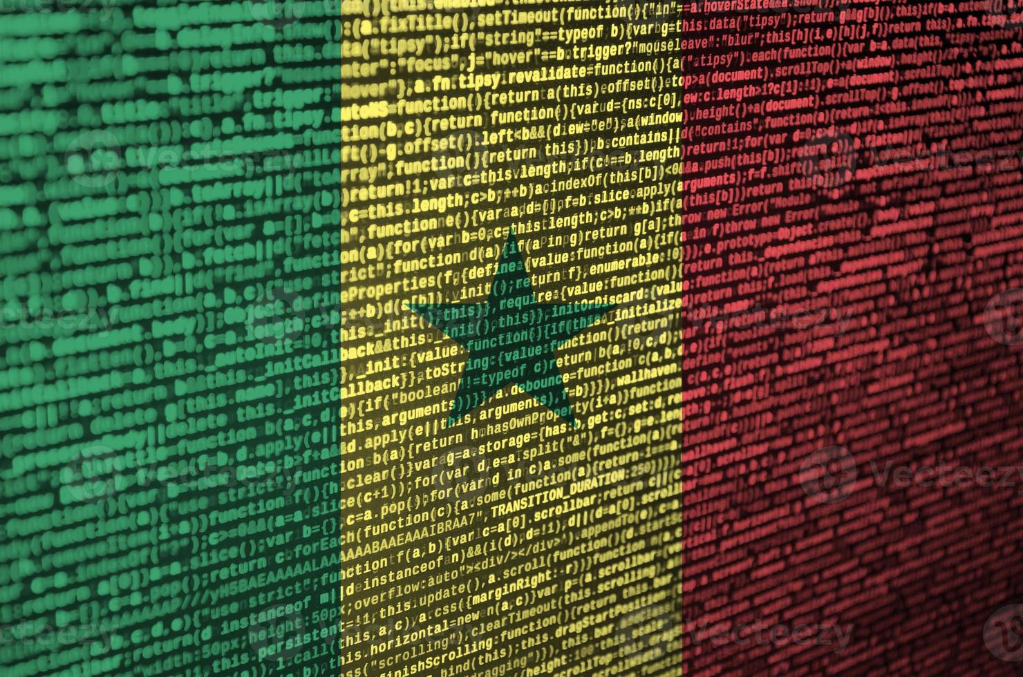 Senegal flag  is depicted on the screen with the program code. The concept of modern technology and site development photo