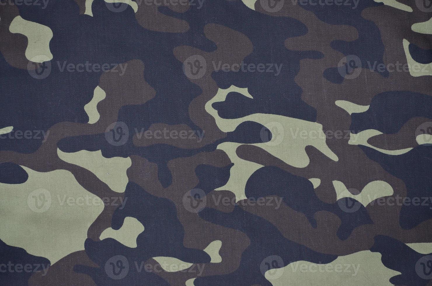 Textile pattern of military camouflage fabric photo