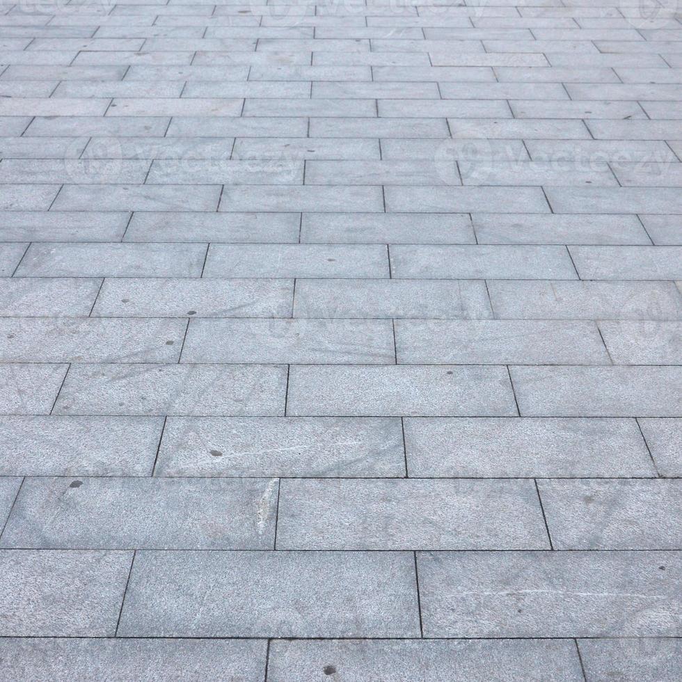 Fragment of the square paved of a large granite tiles photo