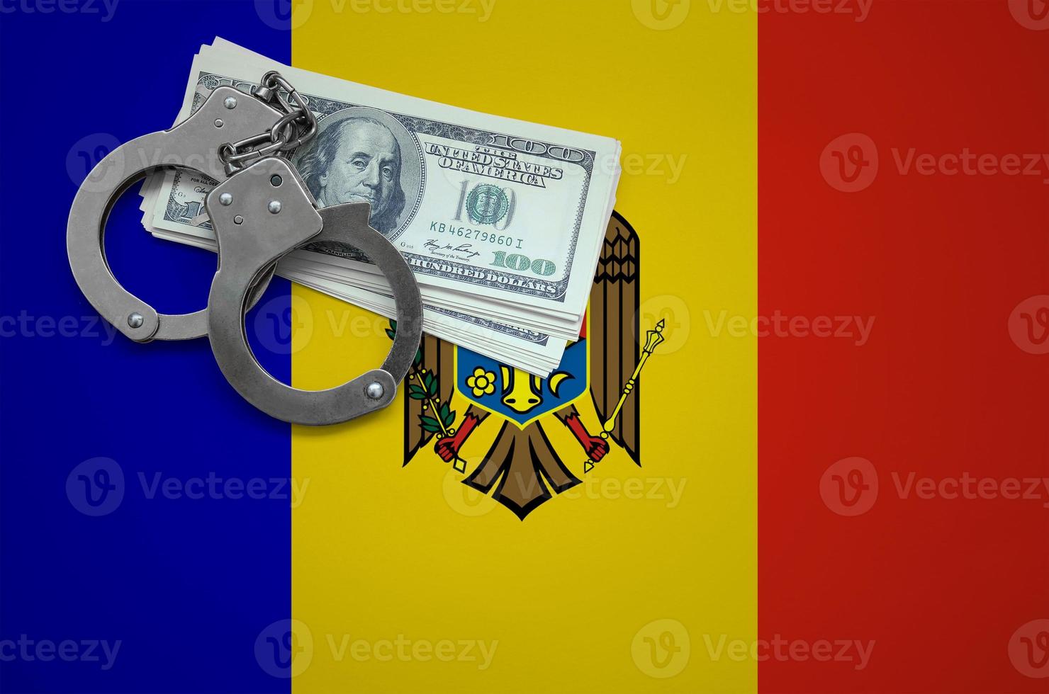 Moldova flag  with handcuffs and a bundle of dollars. The concept of breaking the law and thieves crimes photo