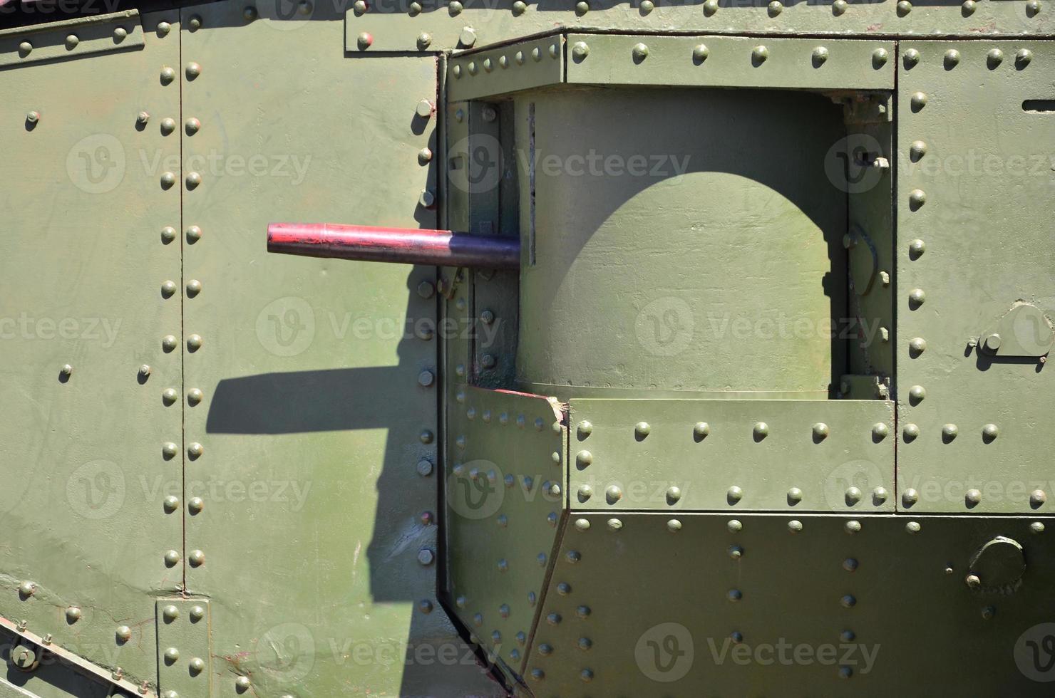 The texture of the wall of the tank, made of metal and reinforced with a multitude of bolts and rivets. Images of the covering of a combat vehicle from the Second World War with a guided machine gun photo