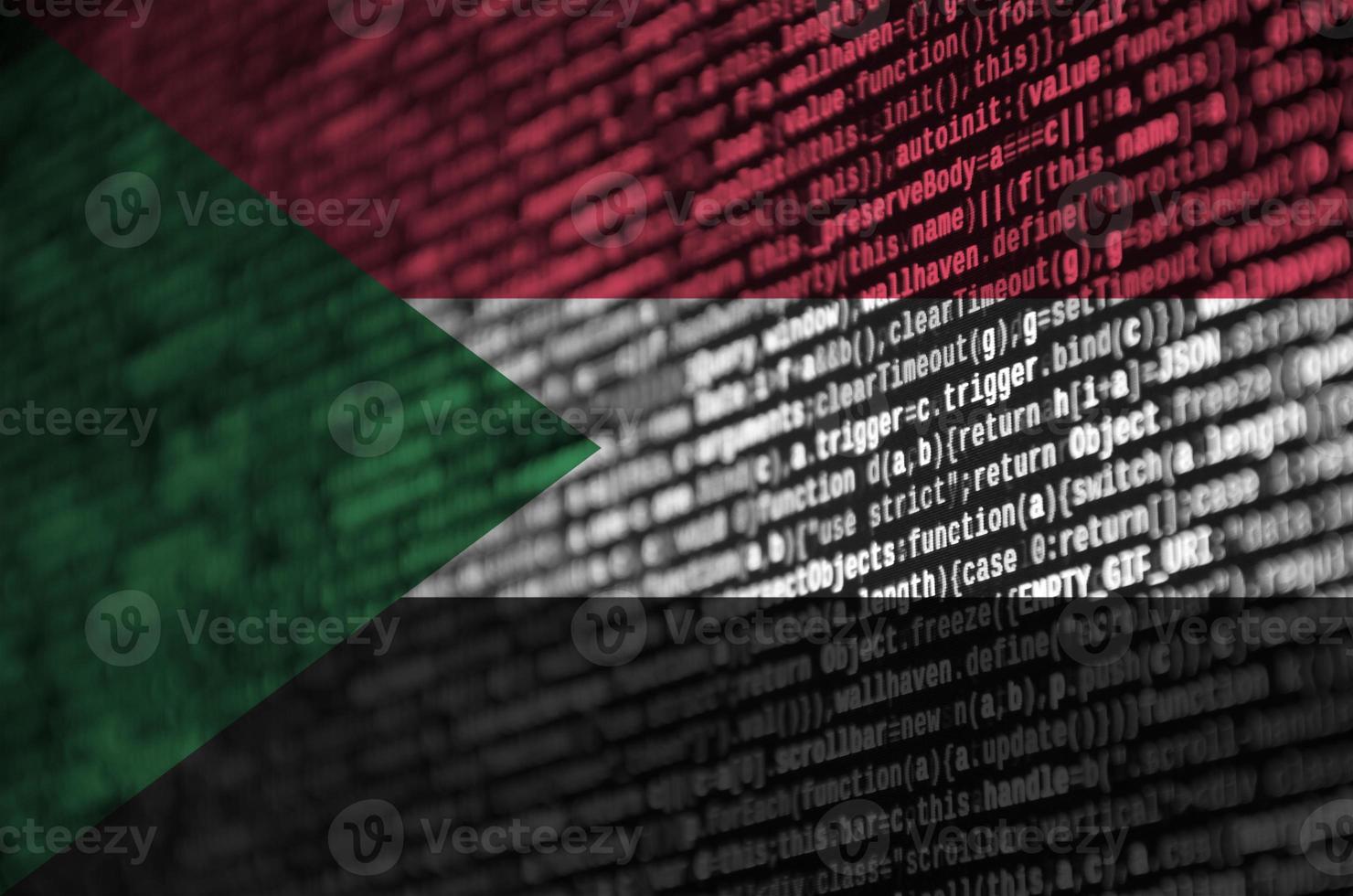 Sudan flag  is depicted on the screen with the program code. The concept of modern technology and site development photo