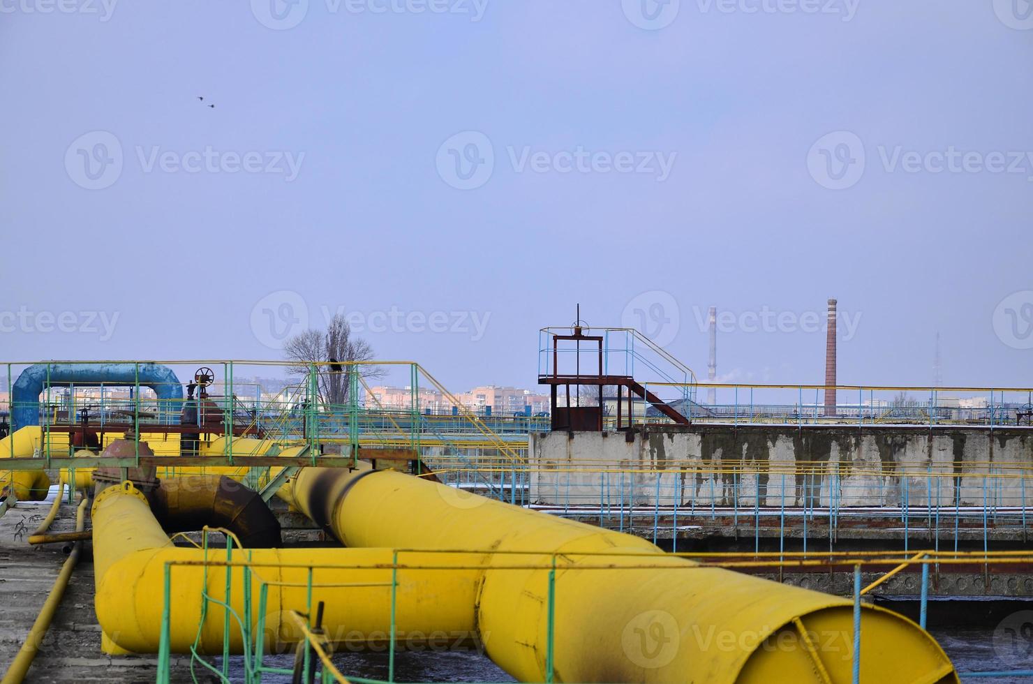 Industrial space with lots of pipes and communications photo