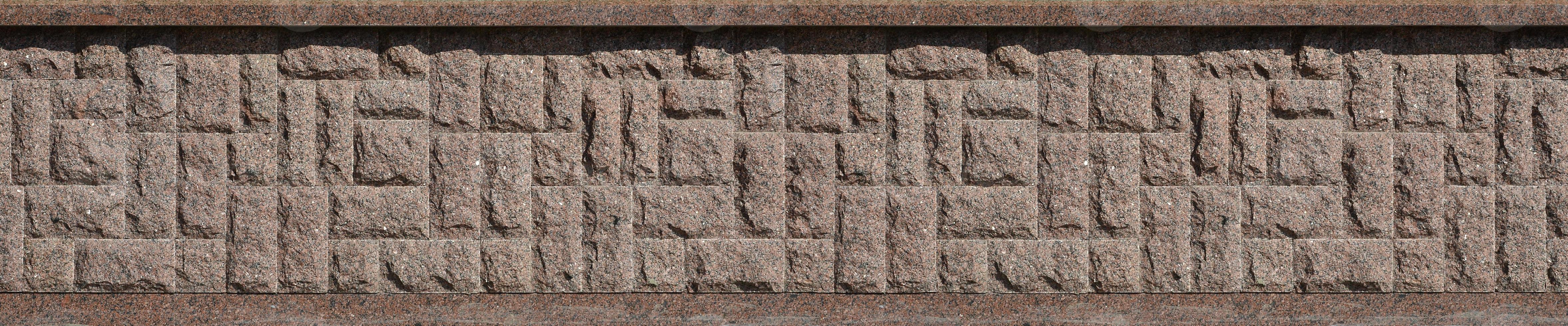 Horizontal texture of coarse and strong mosaic granite stone foundation photo