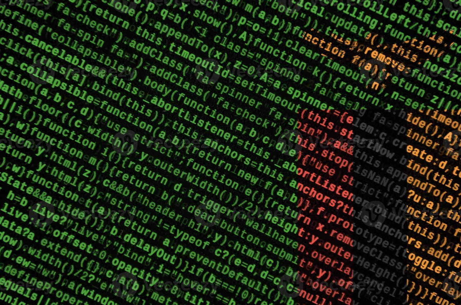 Zambia flag  is depicted on the screen with the program code. The concept of modern technology and site development photo