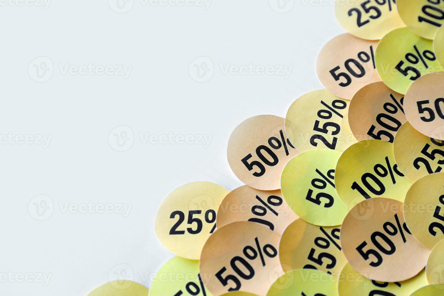 Large amount of stickers with yellow percentage values for black friday or cyber monday sale. Abstract image of discount prices photo