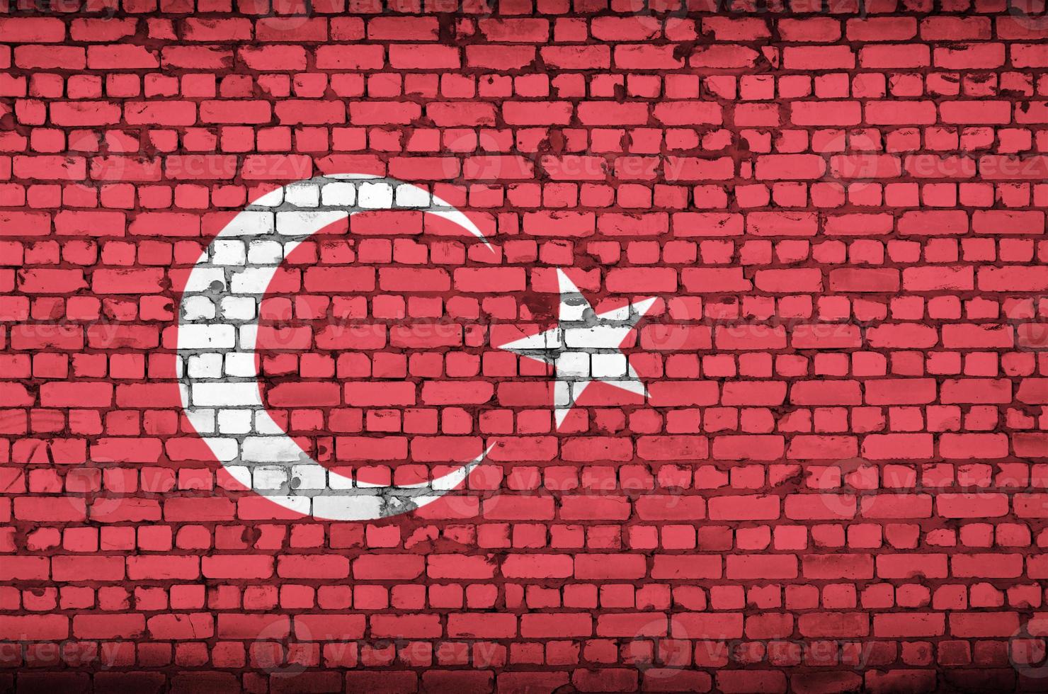 Turkey flag is painted onto an old brick wall photo