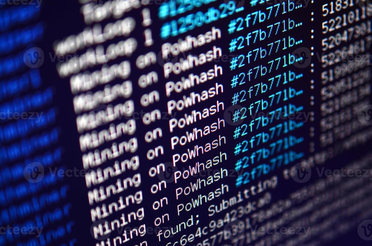 Macro snapshot of the program interface for crypto currency mining on the monitor of an office computer. The concept of mining bitcoins. The flow of information strings and data photo