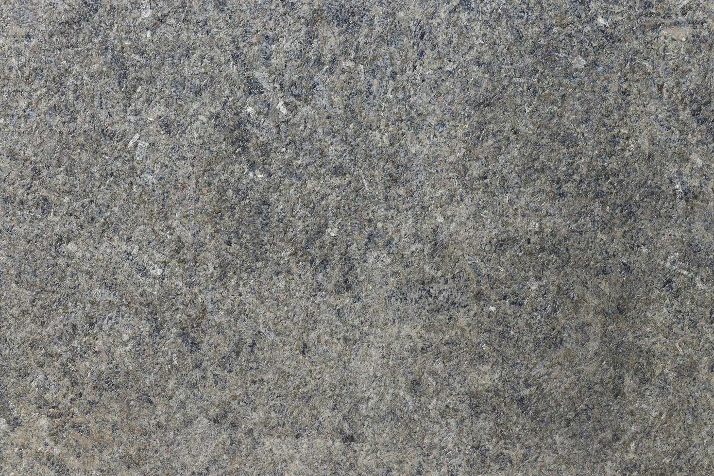 Grey shimmering background imitation dust with shiny balls. Abstract pattern sequins. Template round particles. Fresh asphalt, granite or marble photo
