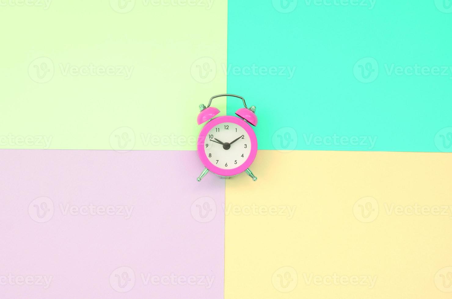 Time to choose metaphor concept. Alarm clock at the crossroads of different colors photo