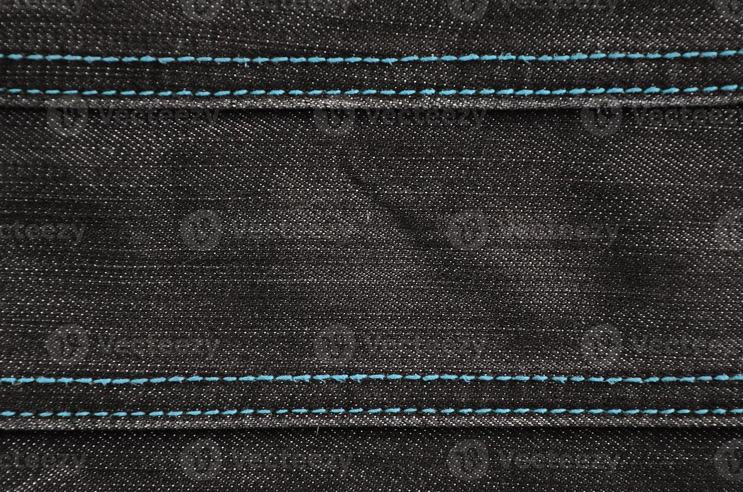 The texture of black denim cloth photo