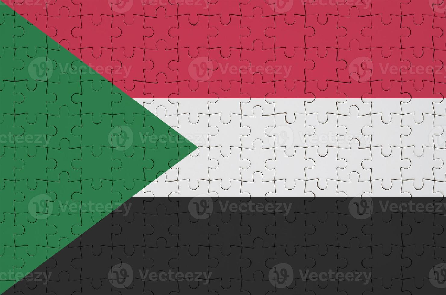 Sudan flag  is depicted on a folded puzzle photo