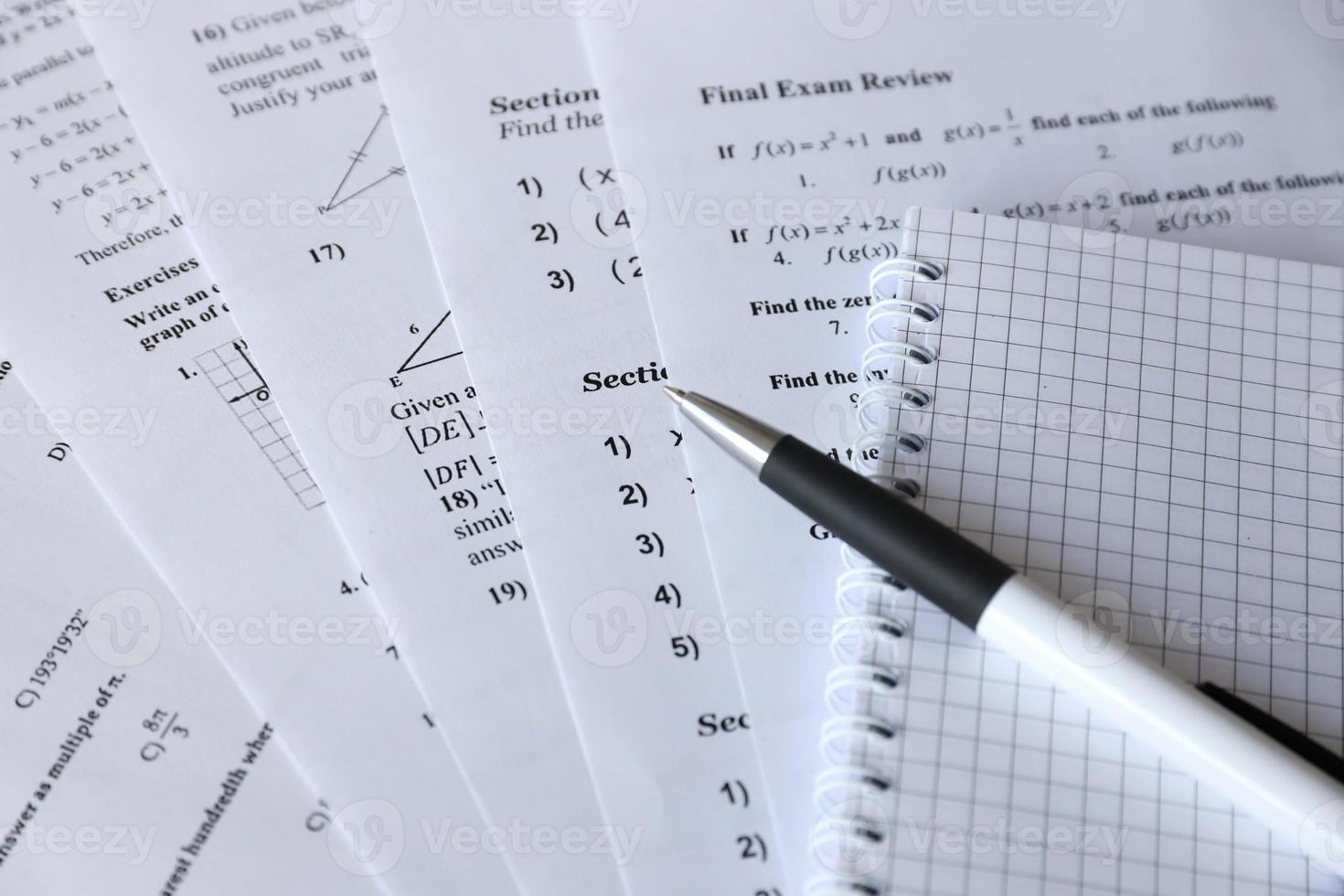 Handwriting of mathematics quadratic equation on examination, practice, quiz or test in maths class. Solving exponential equations concept. photo