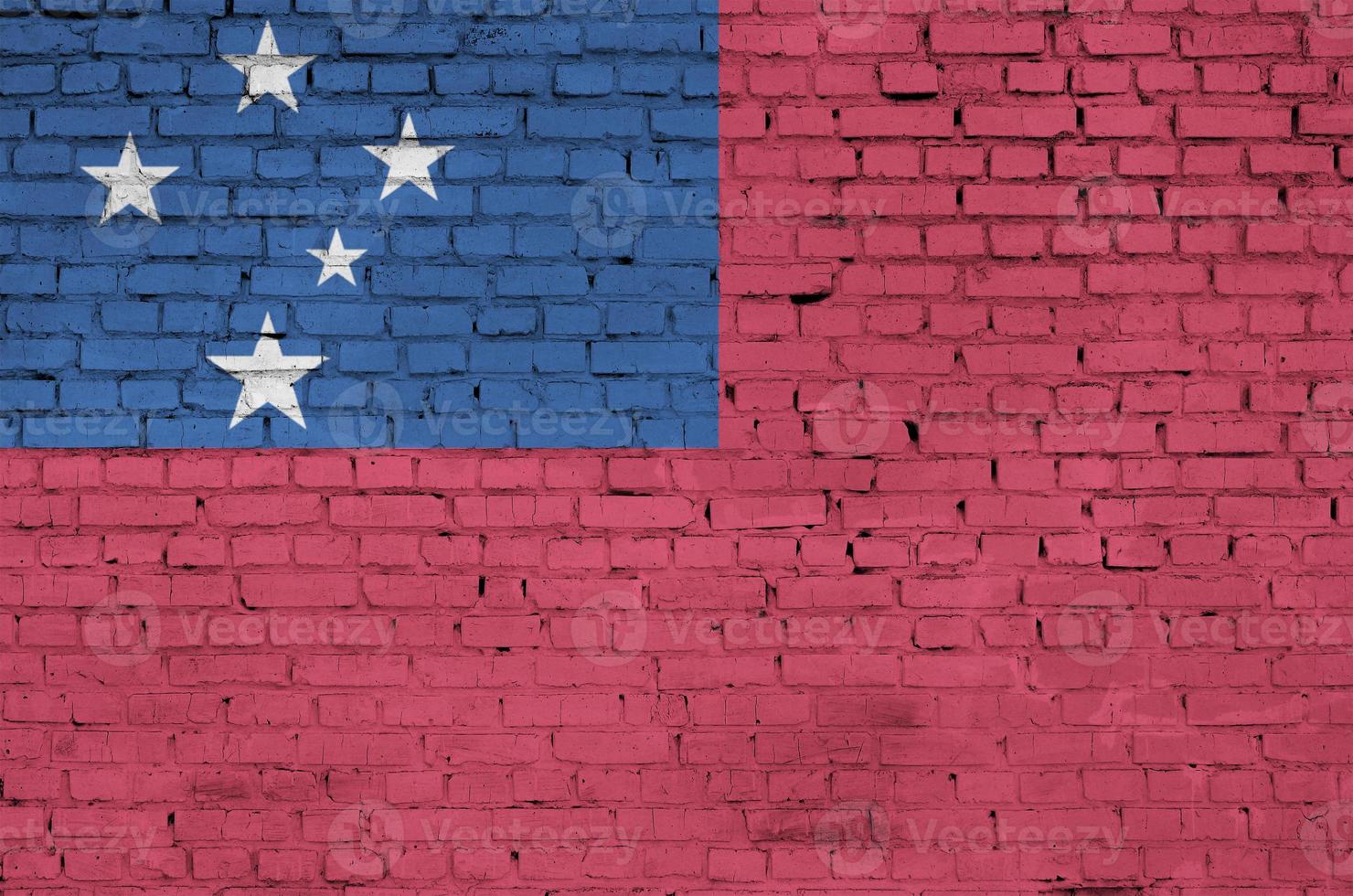 Samoa flag is painted onto an old brick wall photo