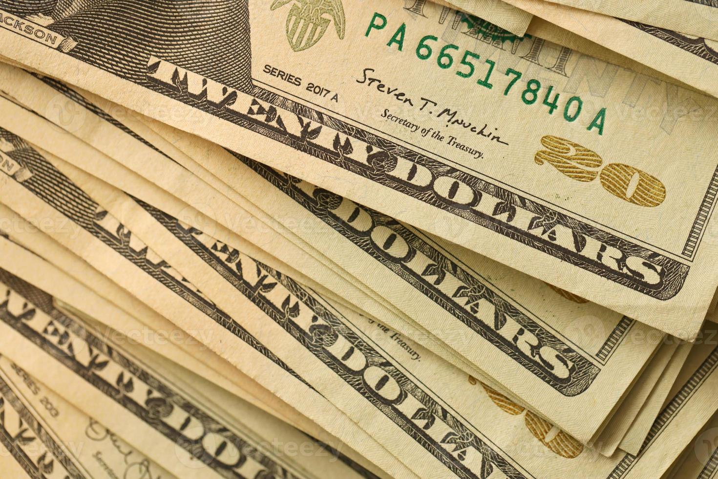 Big amount of old 20 dollar bills details on macro photography. Money earnings, payday or tax paying period photo