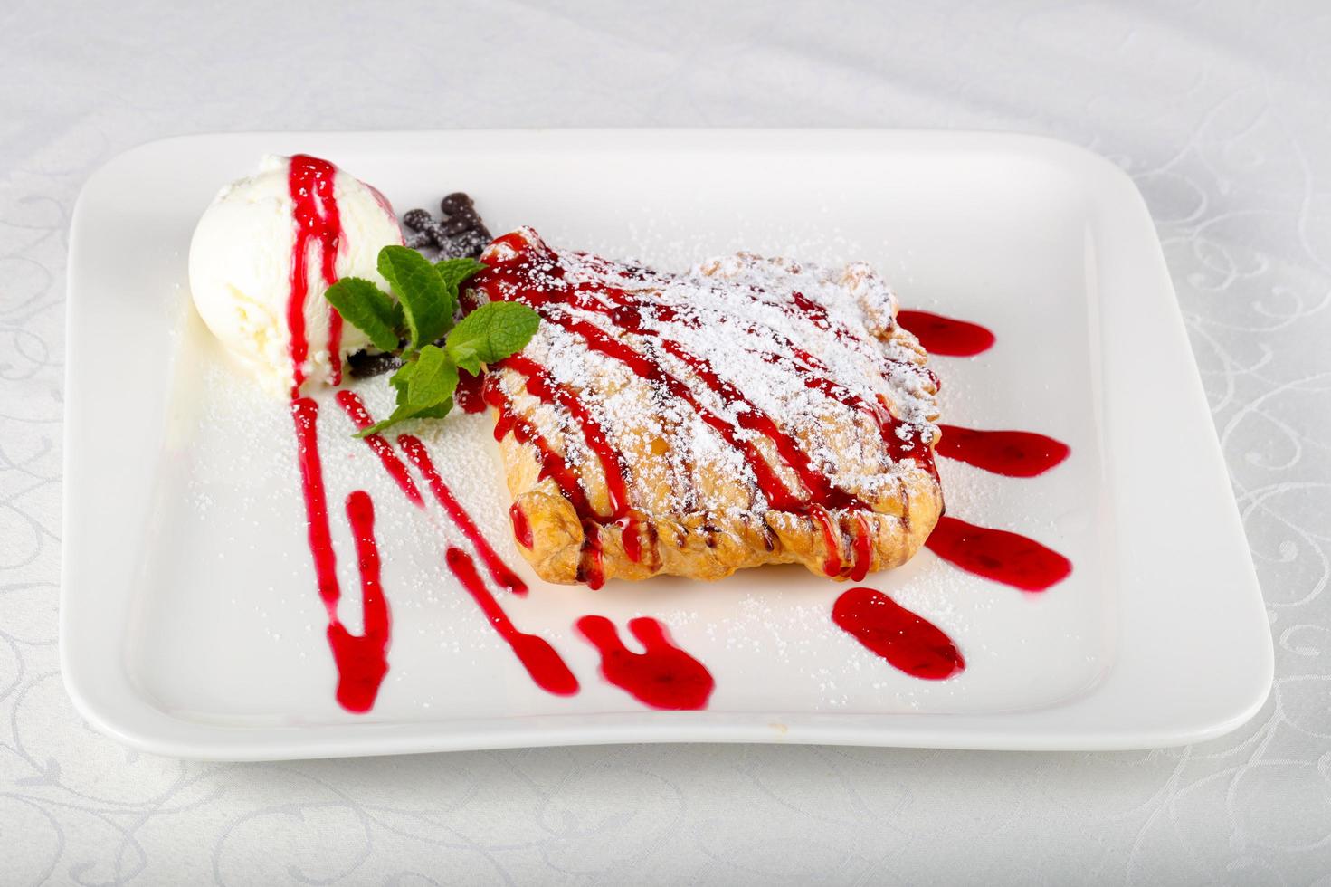 Strudel on the plate and white background photo