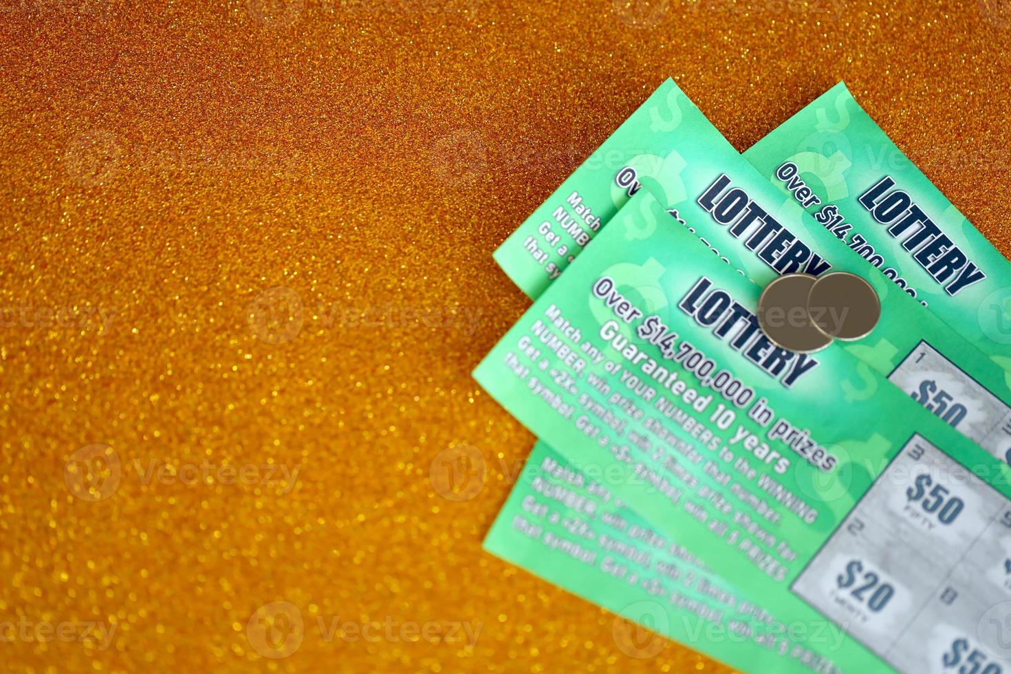 Close up view of green lottery scratch cards. Many used fake instant lottery tickets with gambling results. Gambling addiction photo