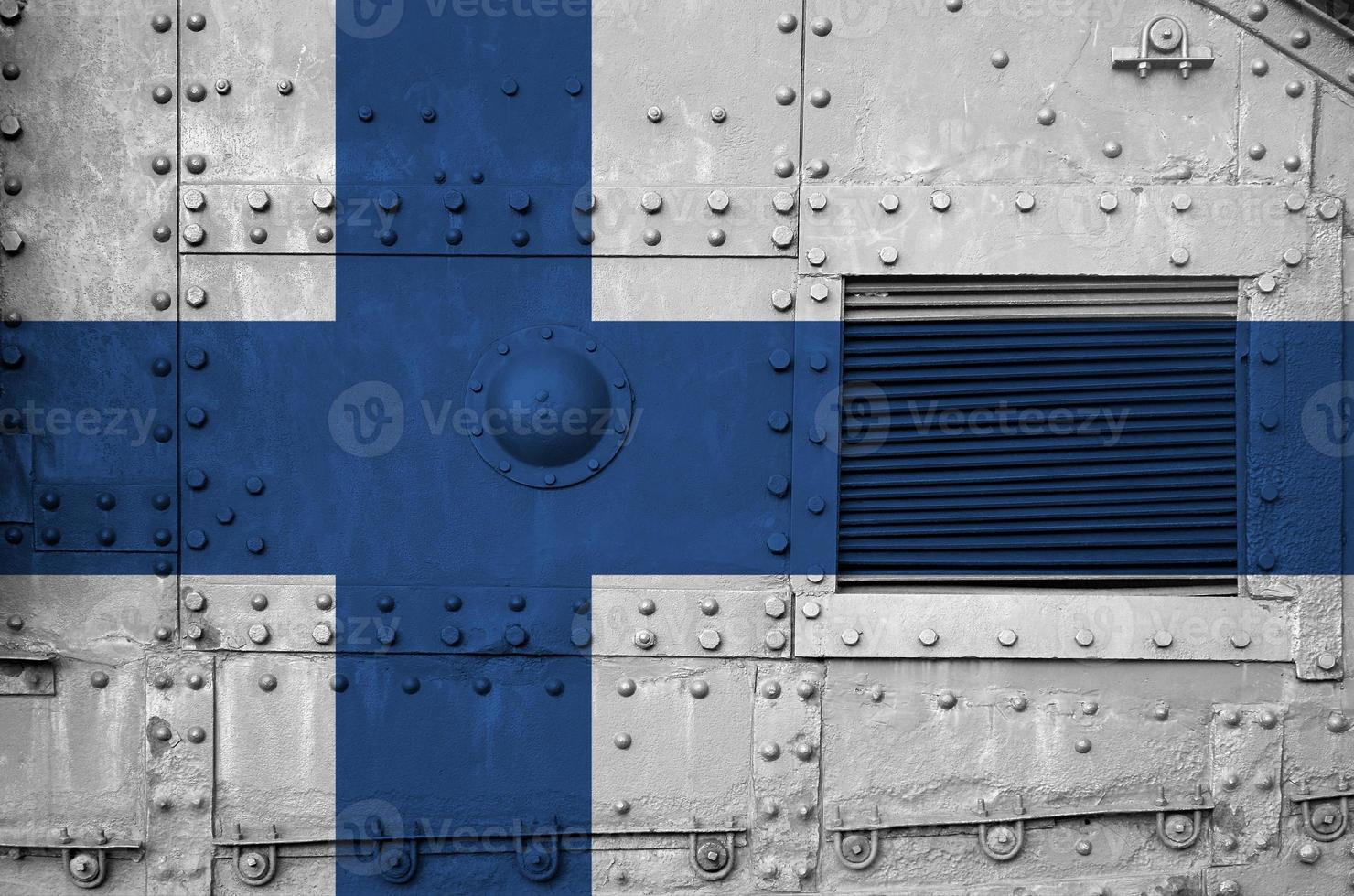 Finland flag depicted on side part of military armored tank closeup. Army forces conceptual background photo