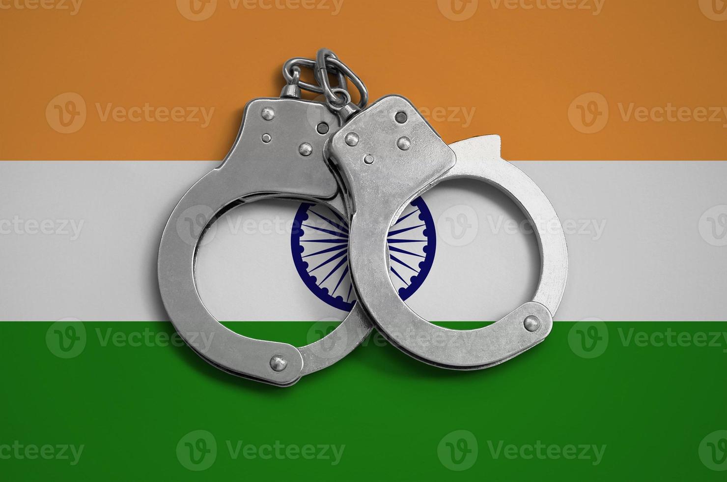 India flag  and police handcuffs. The concept of observance of the law in the country and protection from crime photo