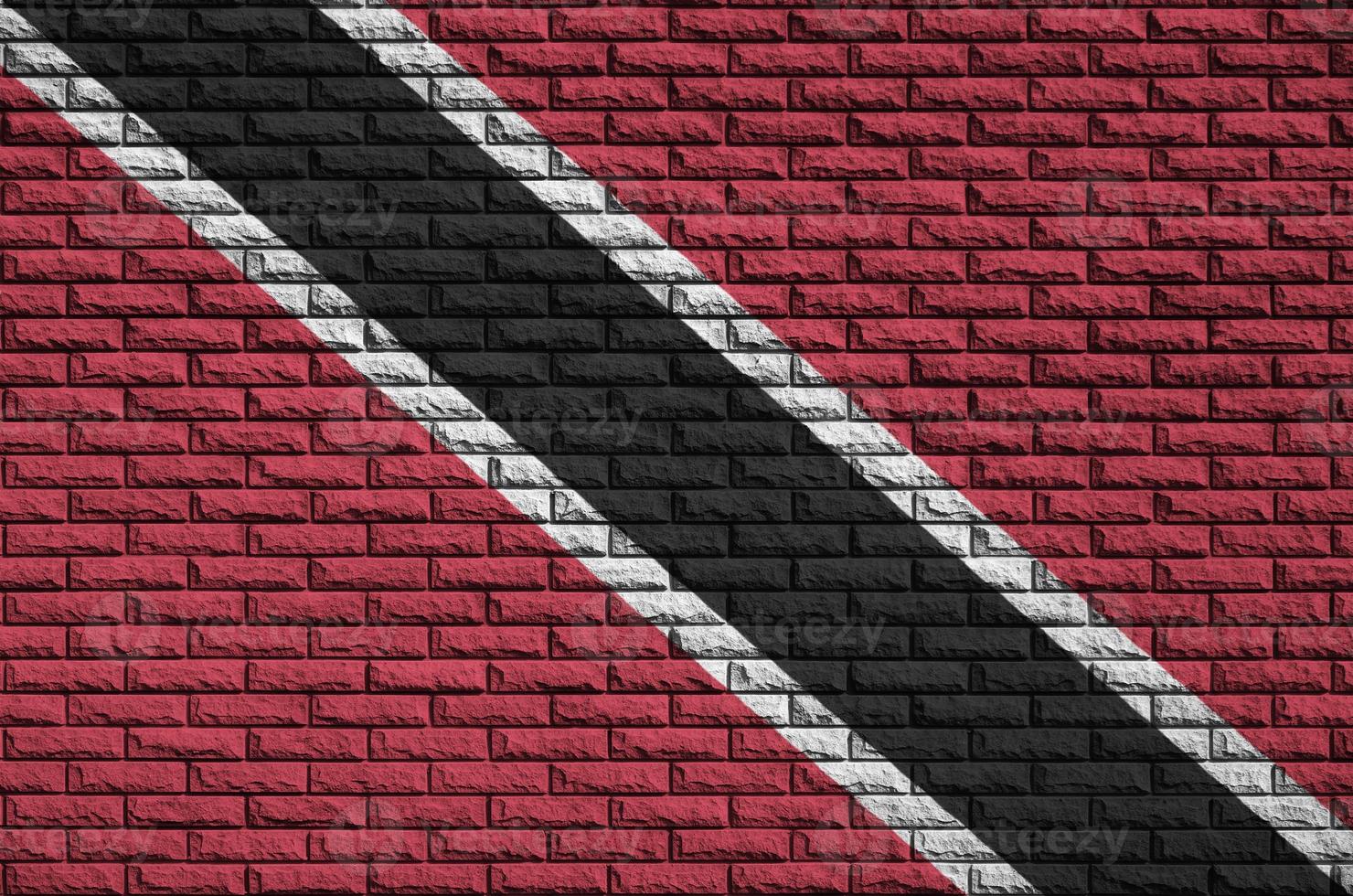 Trinidad and Tobago flag is painted onto an old brick wall photo
