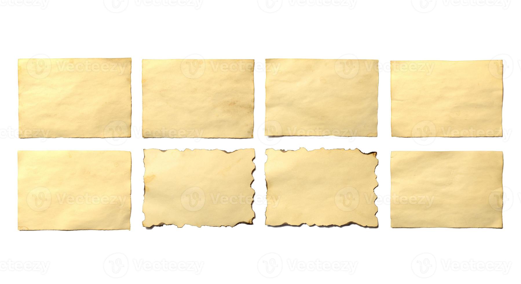 Set of old blank pieces of antique vintage crumbling paper manuscript or parchment photo