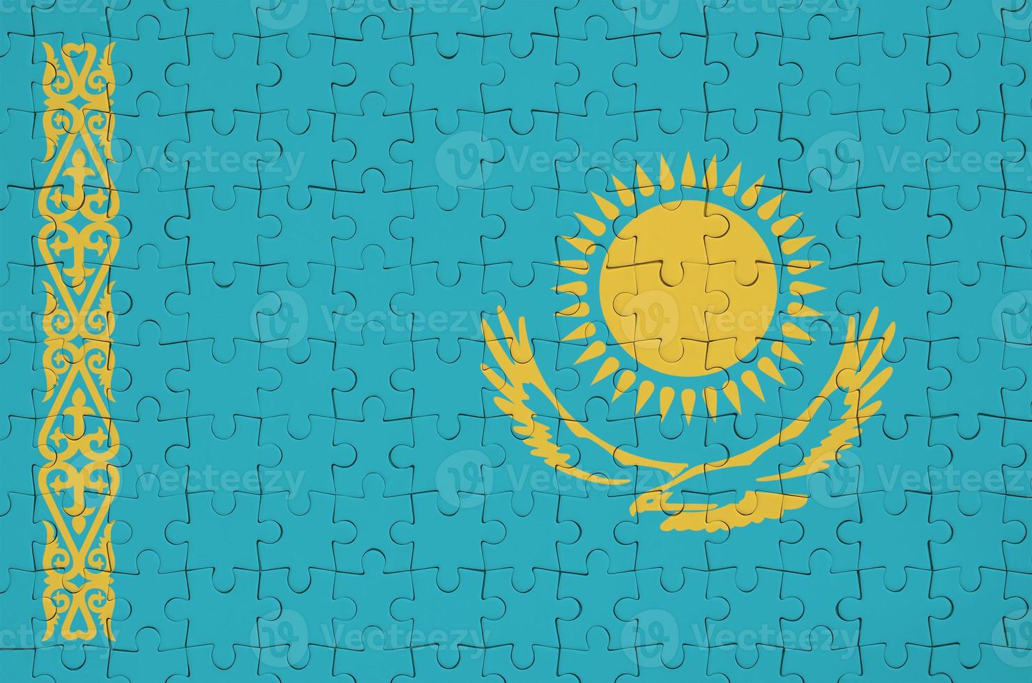 Kazakhstan flag is depicted on a folded puzzle 12841761 Stock Photo at