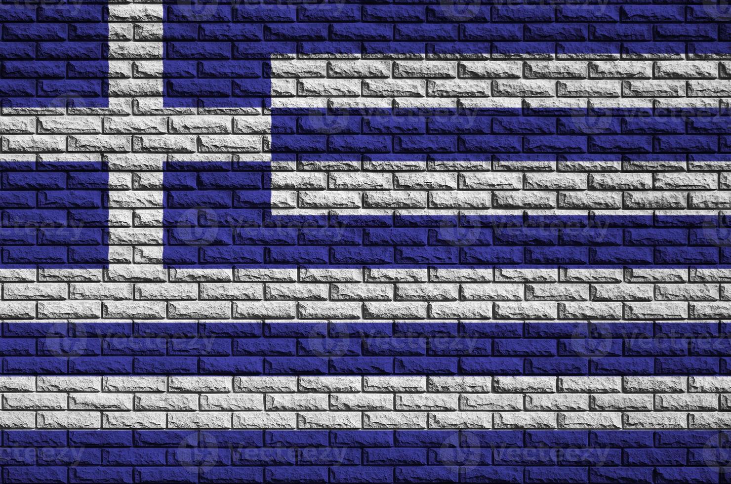 Greece flag is painted onto an old brick wall photo