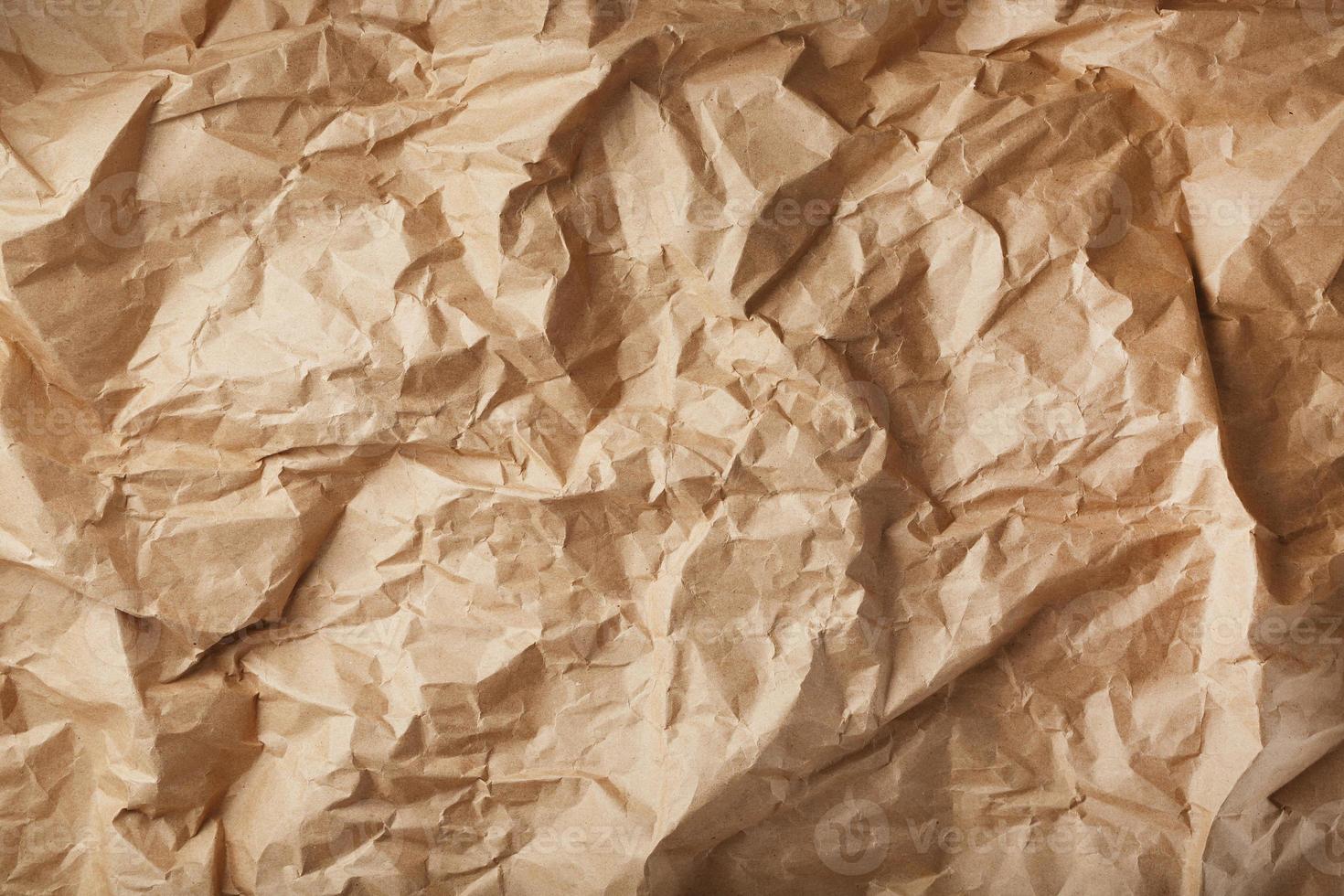 Craft crumpled paper as a texture background. photo