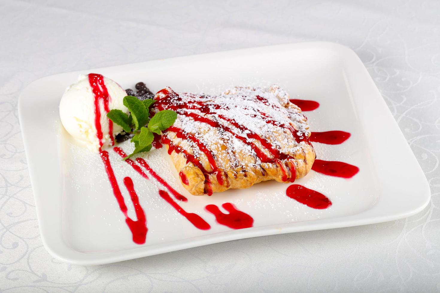 Strudel on the plate and white background photo