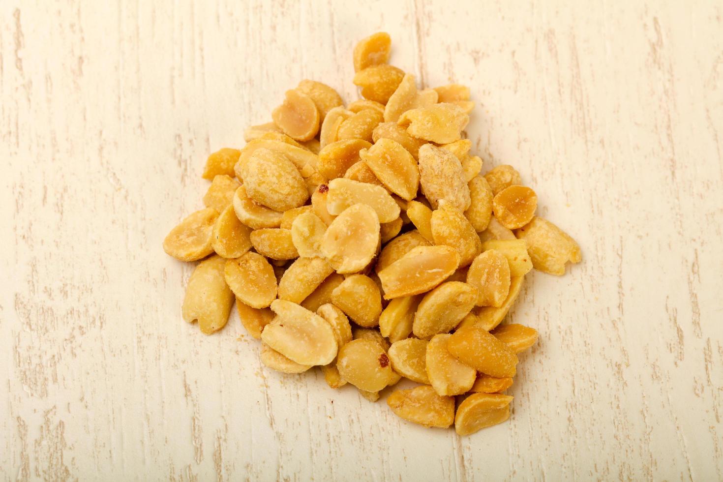Peanut on wooden background photo