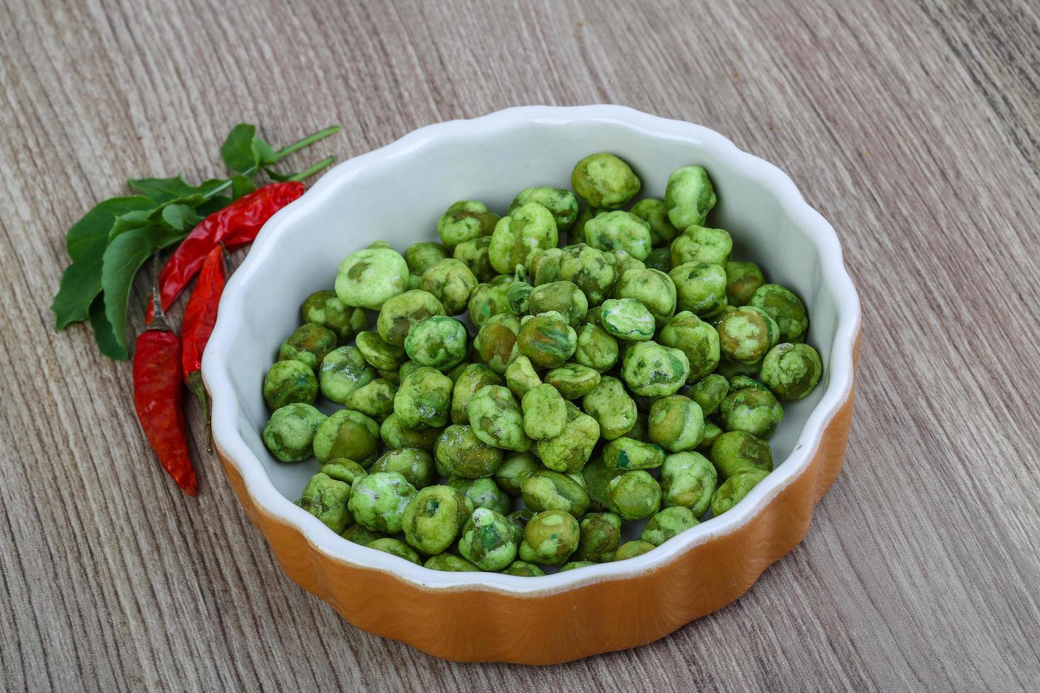 Wasabi peas on wood photo