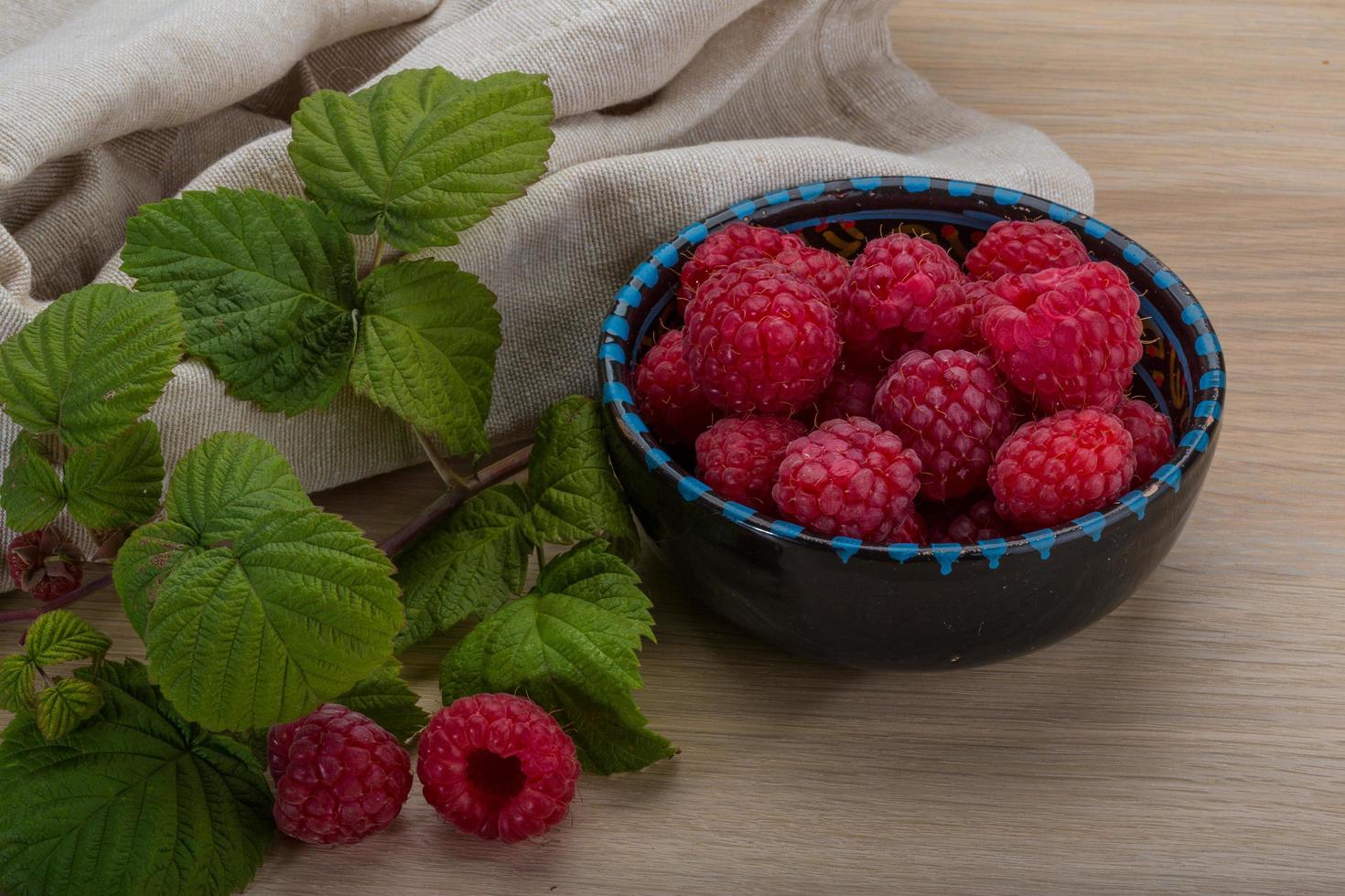 Fresh raspberry on wood photo