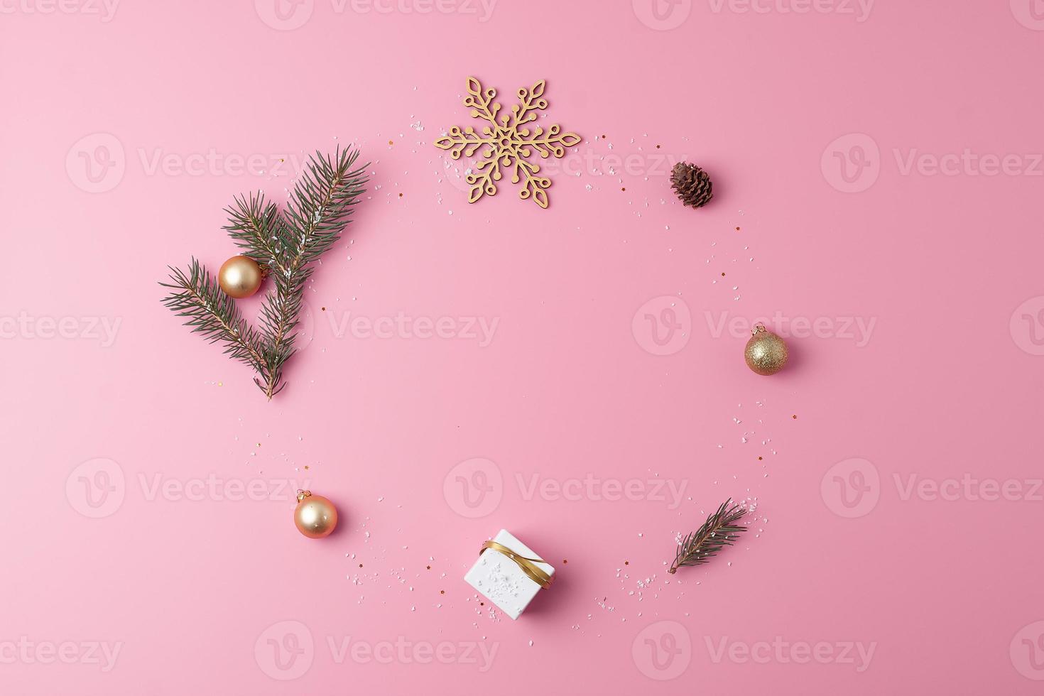 Christmas decorations with gift on pink background. Flat lay, copy space photo