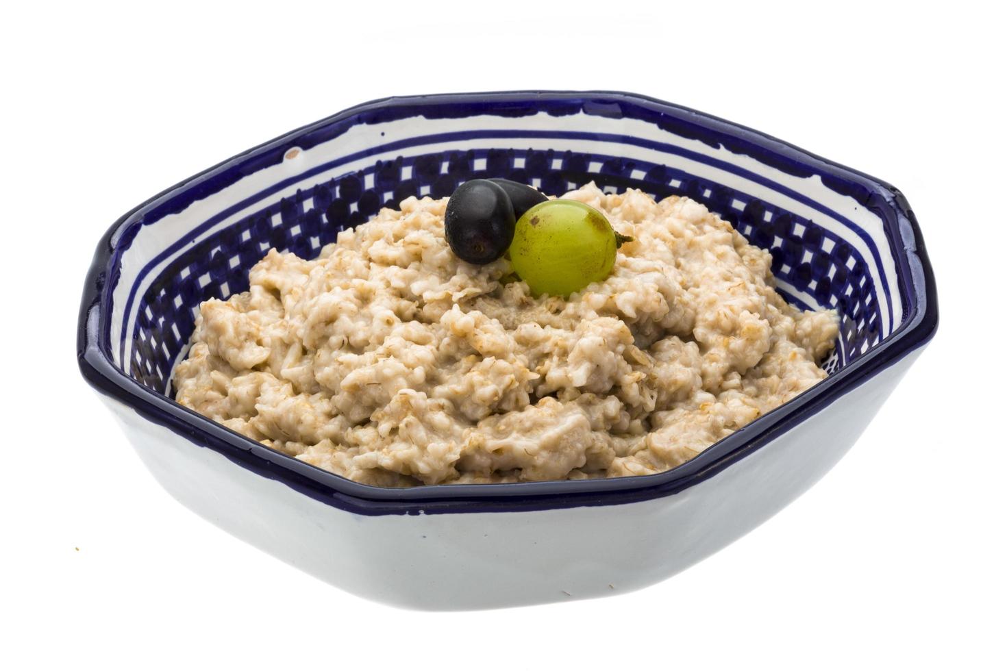 Oats porridge on white photo