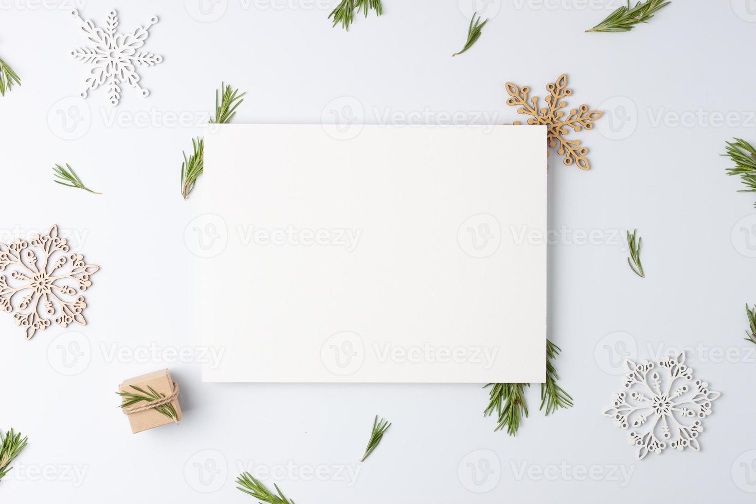 Zero waste Christmas natural decoration with white mock up frame on white background. Flat lay, copy space photo