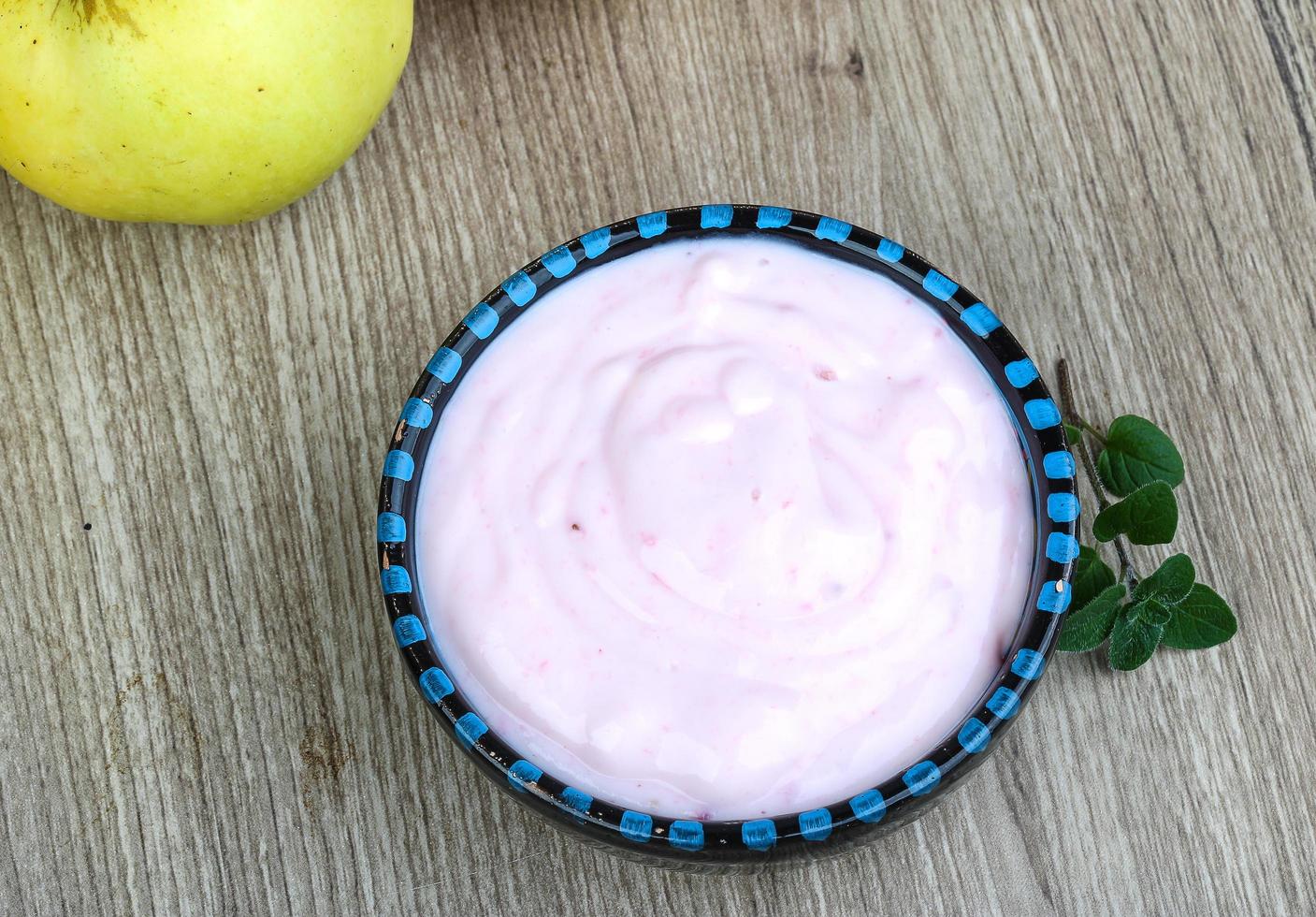 Strawberry yoghurt on wood photo