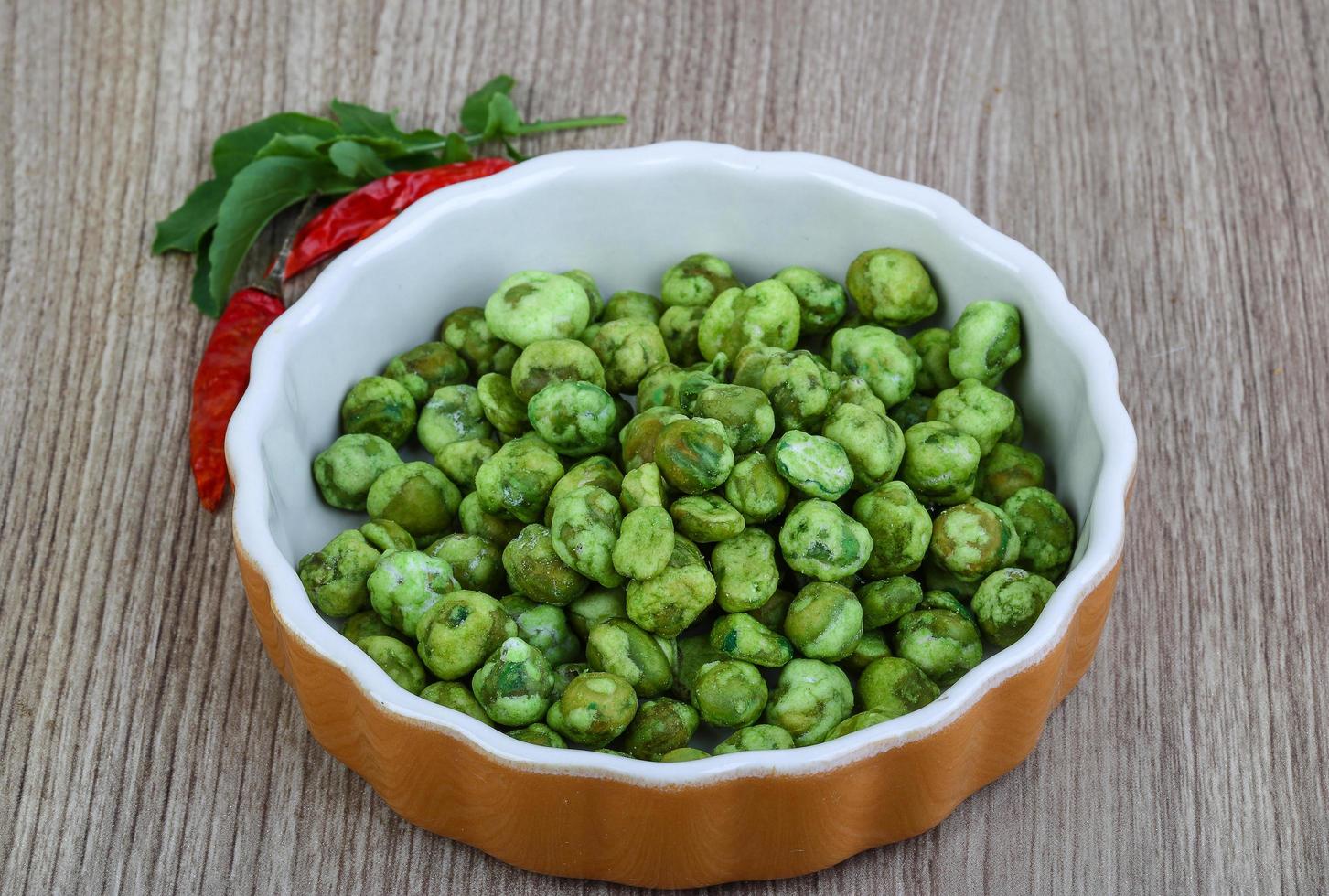 Wasabi peas on wood photo